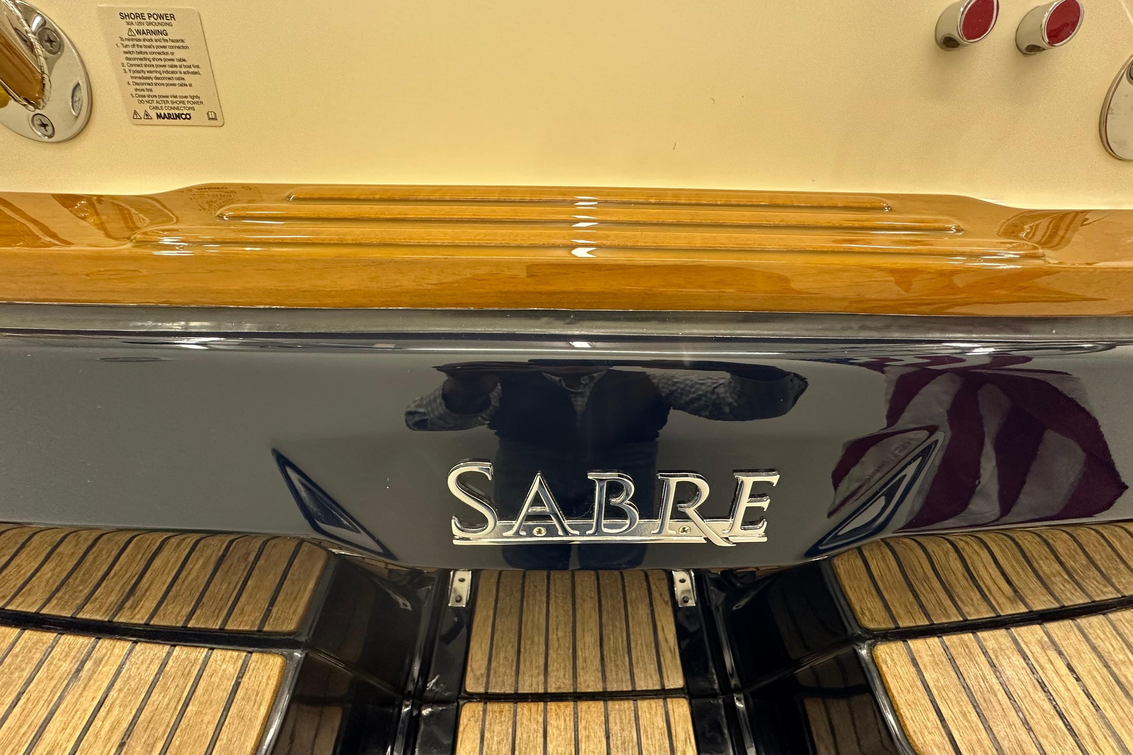2007 Sabre 386 boat stern with wood accents and brand logo.