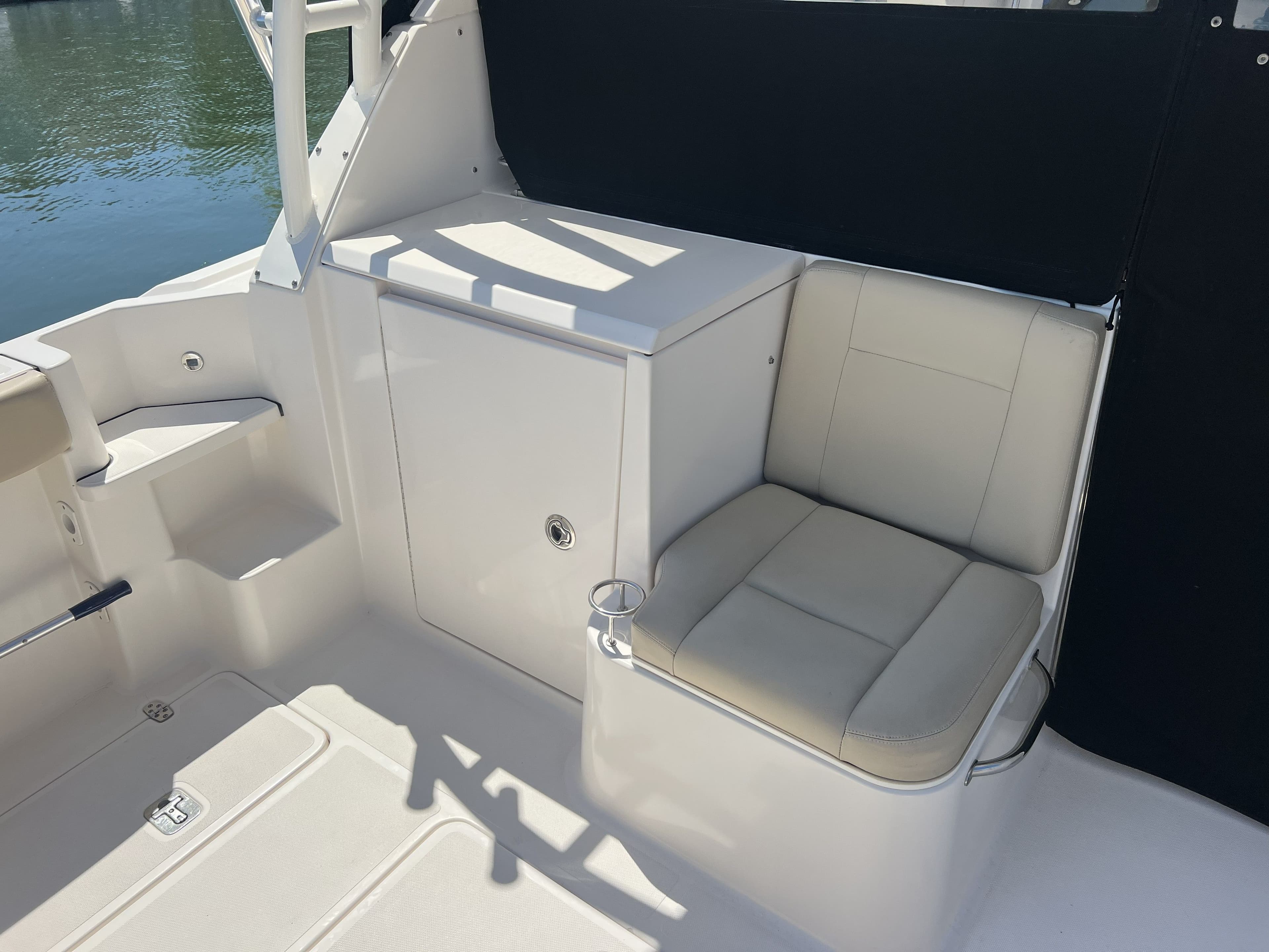 Interior of 2015 Pursuit 325 OS Offshore with seating area.