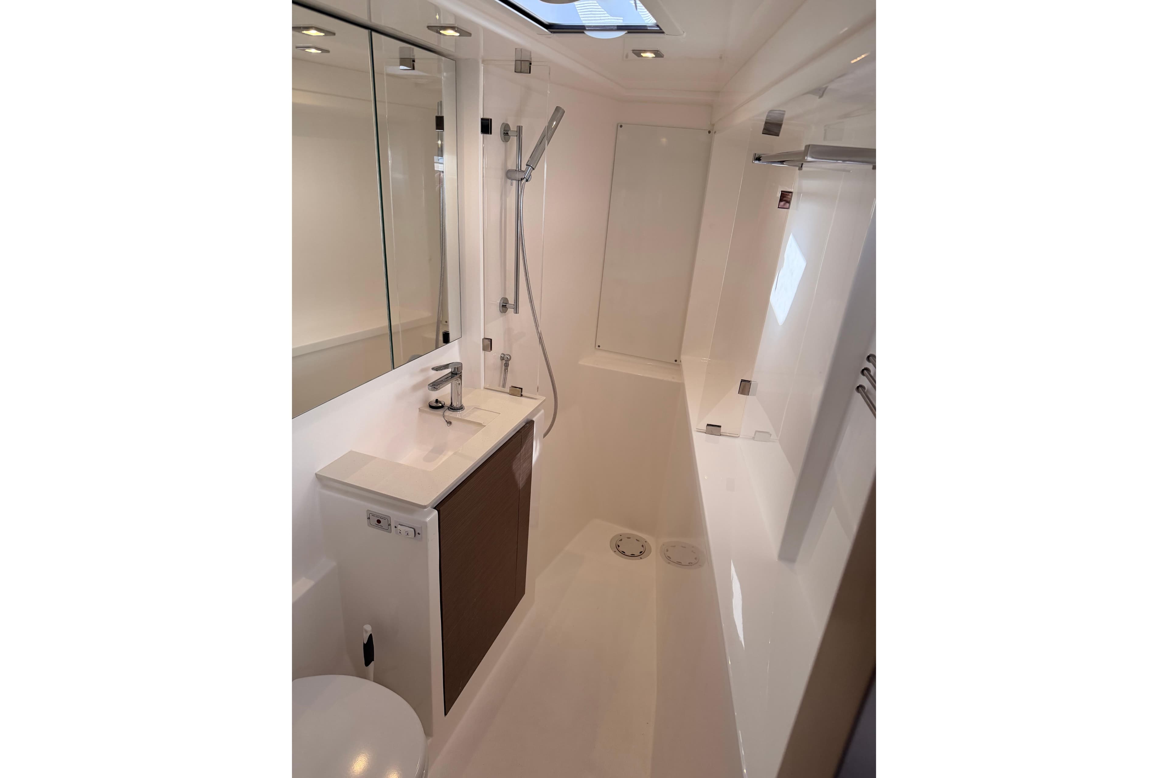 Modern bathroom interior on a 2023 Leopard 50 yacht, featuring sleek fixtures and a shower.