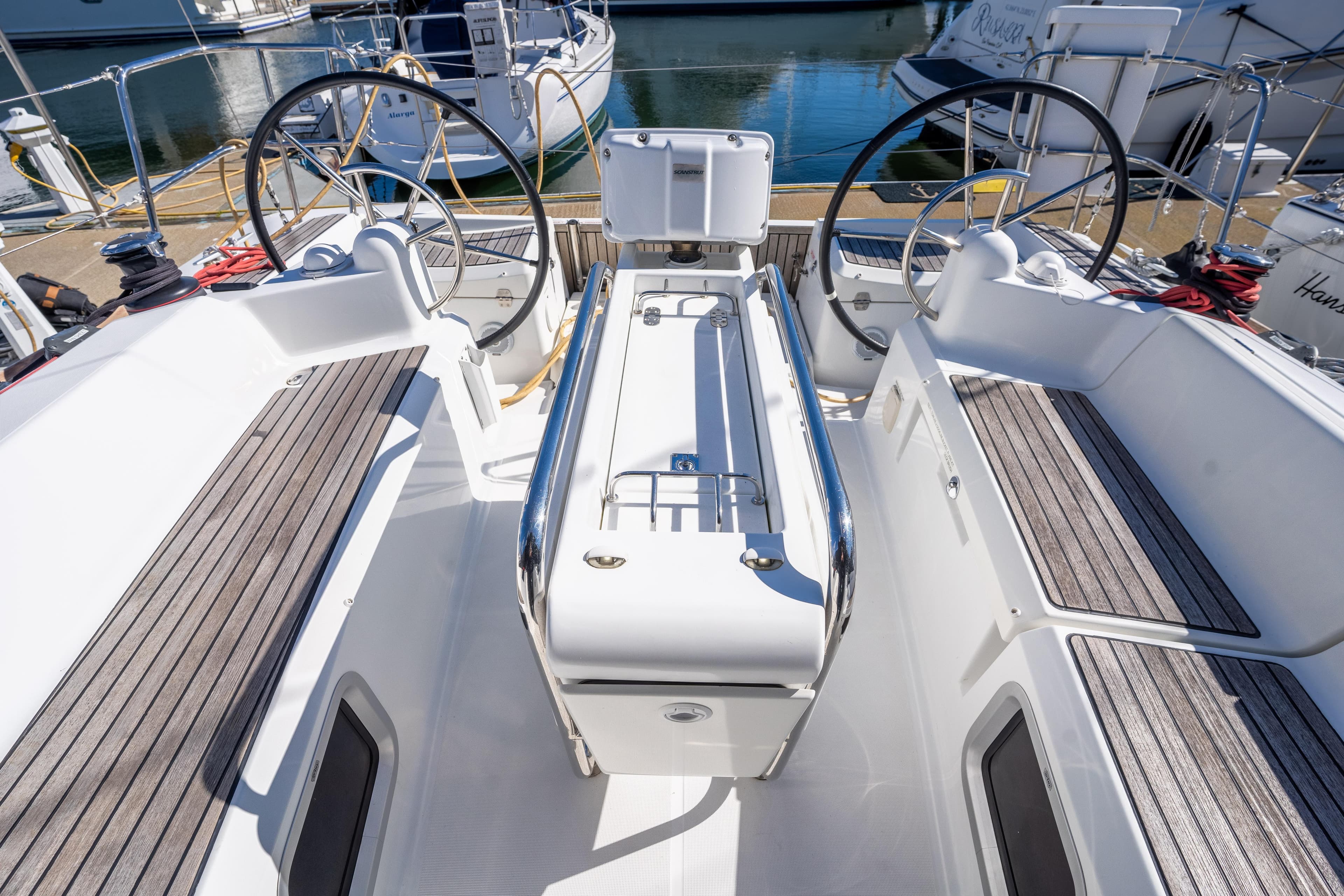 Cockpit of 2020 Jeanneau Sun Odyssey 389 sailboat with dual steering wheels.