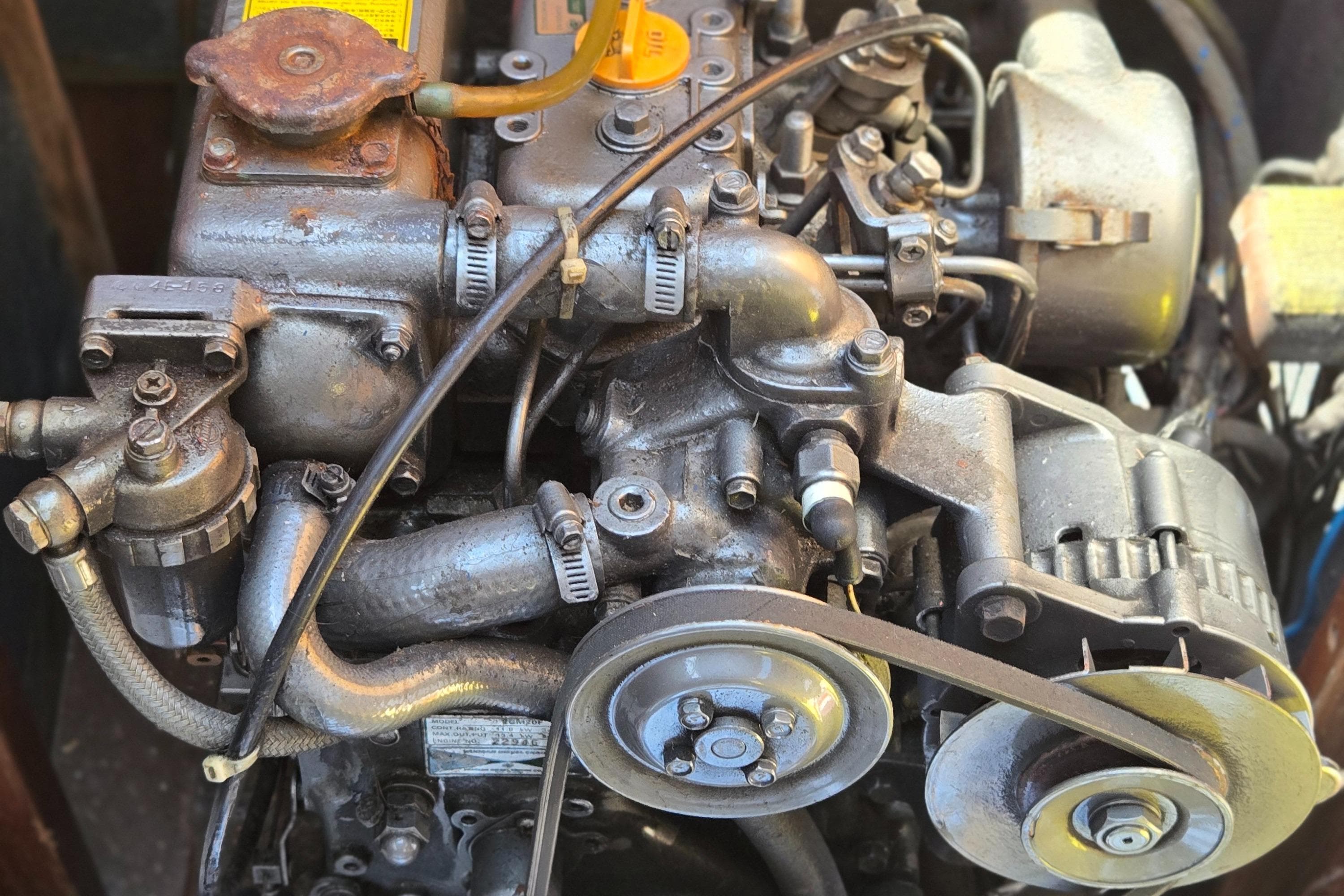Engine of a 1987 Dehler Optima 34 sailboat, showcasing mechanical components.