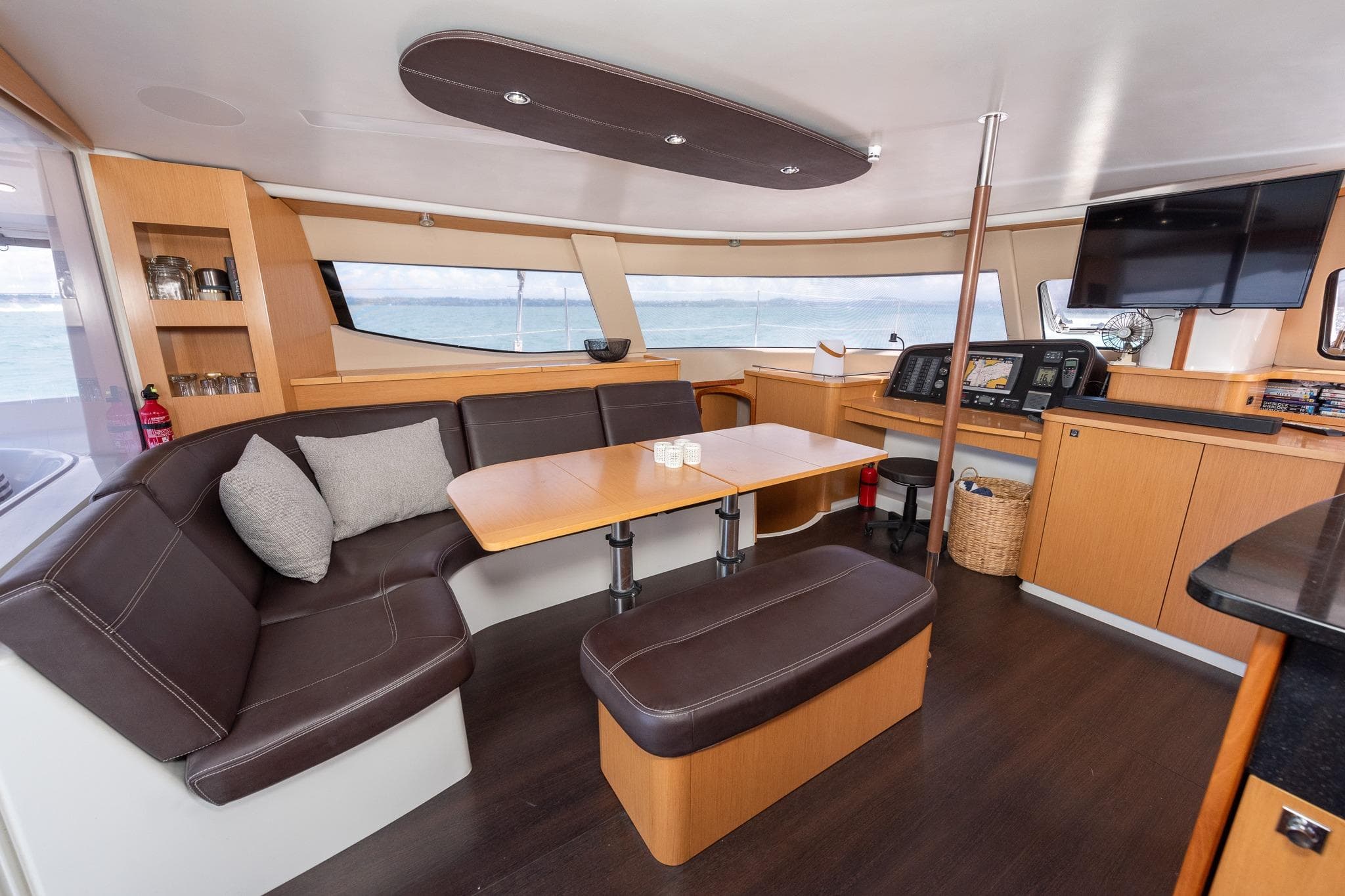 Luxurious interior of 2011 Fountaine Pajot Salina 48 catamaran with modern seating and navigation area.