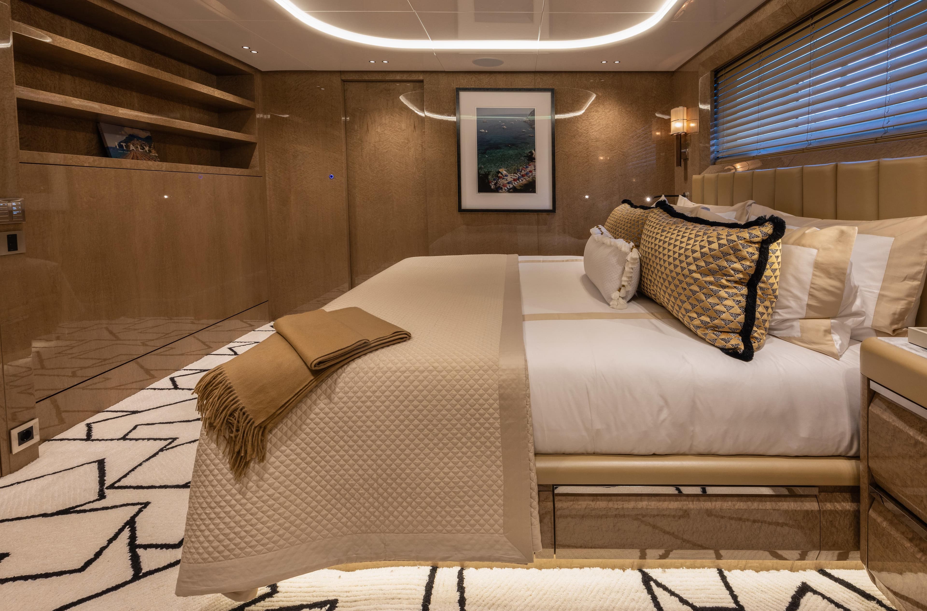 Luxurious bedroom interior of 2023 Mengi Yay Virtus 47 yacht with elegant decor and plush bedding.