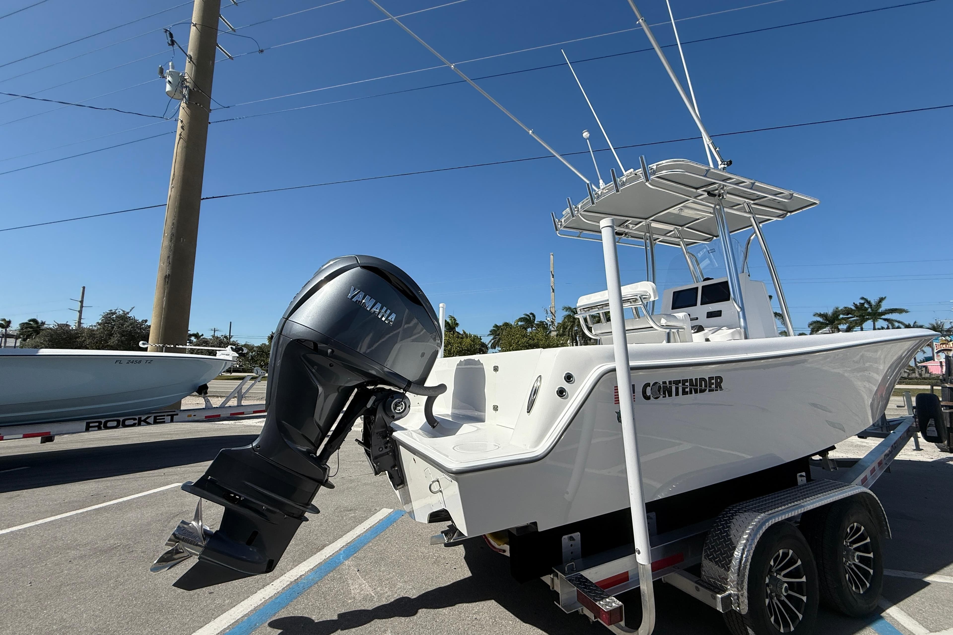 2026 Contender 25 Tournament boat with Yamaha outboard engine on trailer.