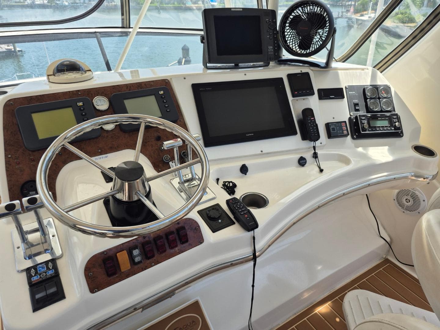 Control panel of a 2002 Silverton 38 Convertible yacht with navigation equipment.