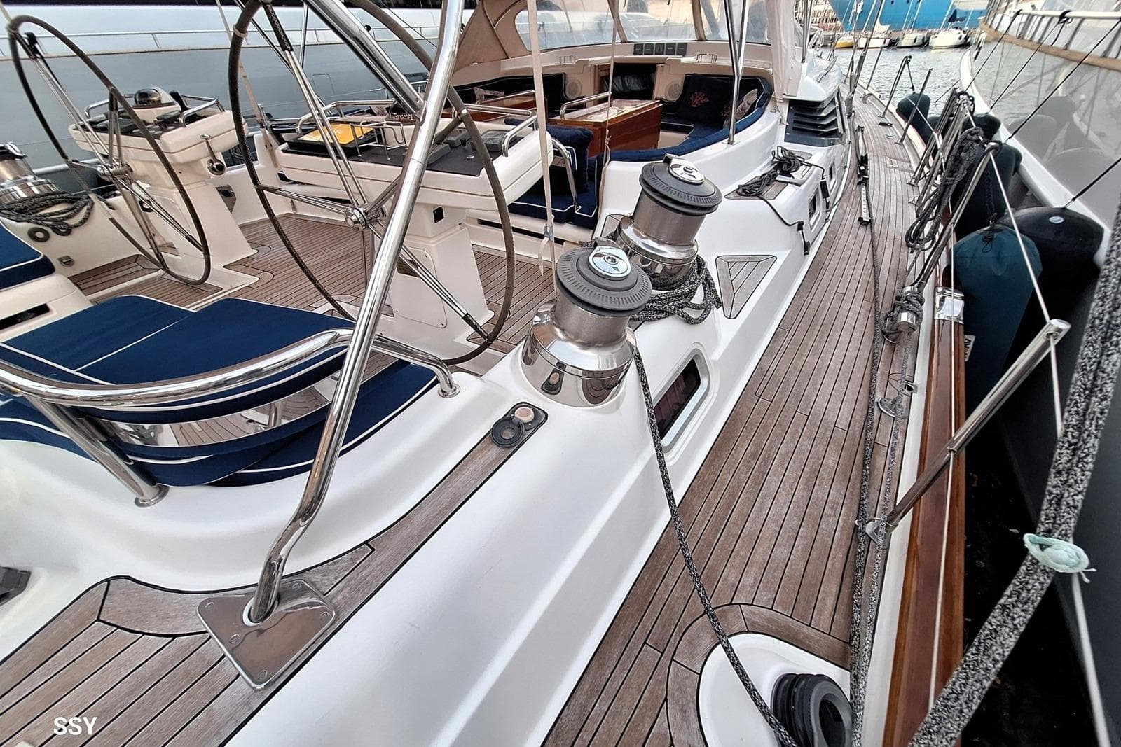 Luxurious 2004 Oyster 825 yacht deck with polished wood and sleek design.