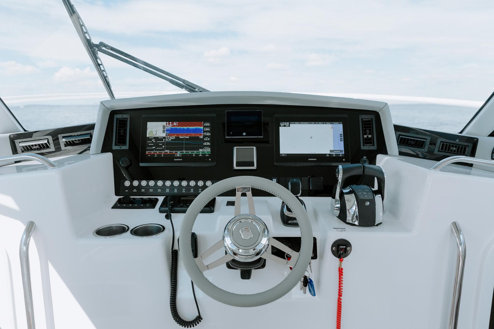 Cockpit of 2025 ArrowCat 320 boat with modern navigation and control systems.