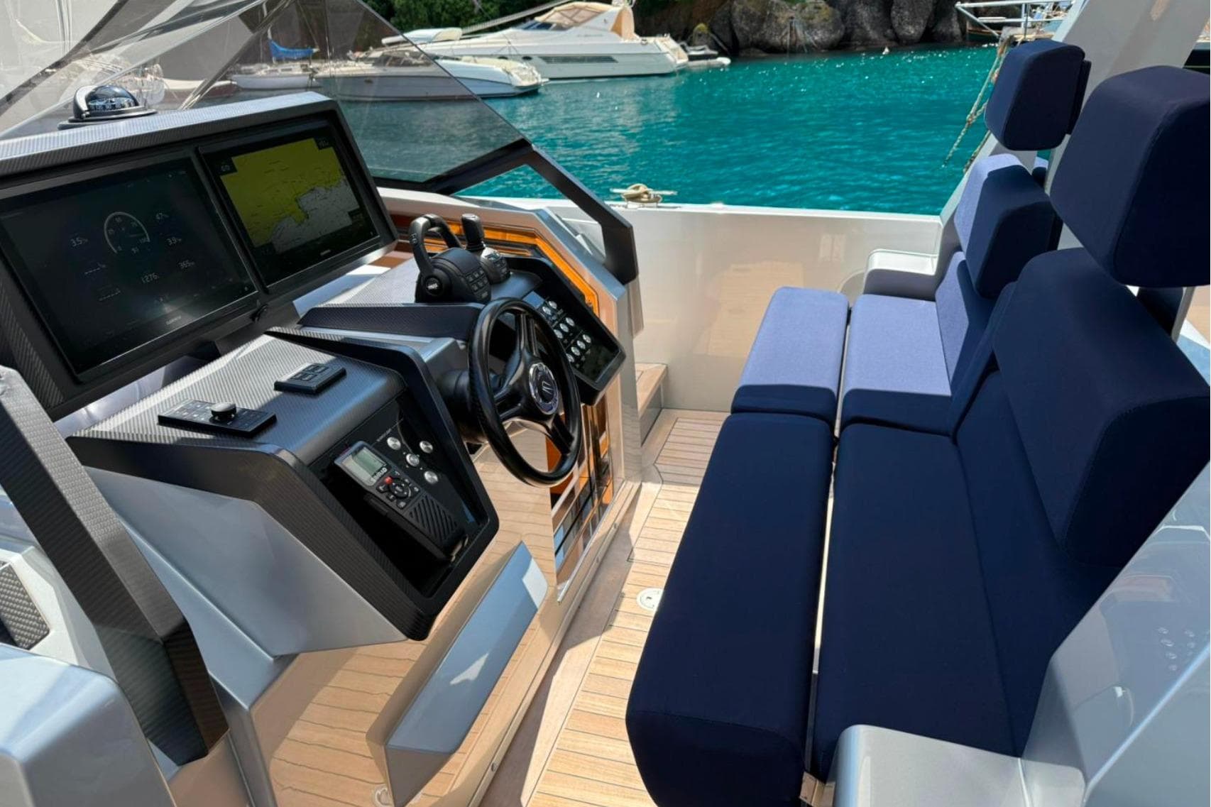 2019 Wally wallytender48 yacht cockpit with modern navigation system and plush seating.