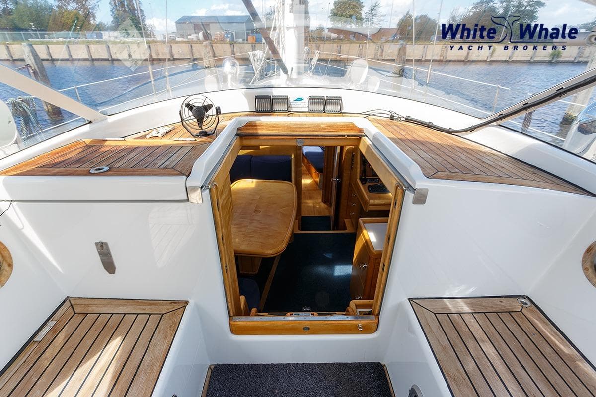 Cockpit view of 1989 Dubbel & Jesse Nordsee 55 yacht with wooden deck and cabin entrance.