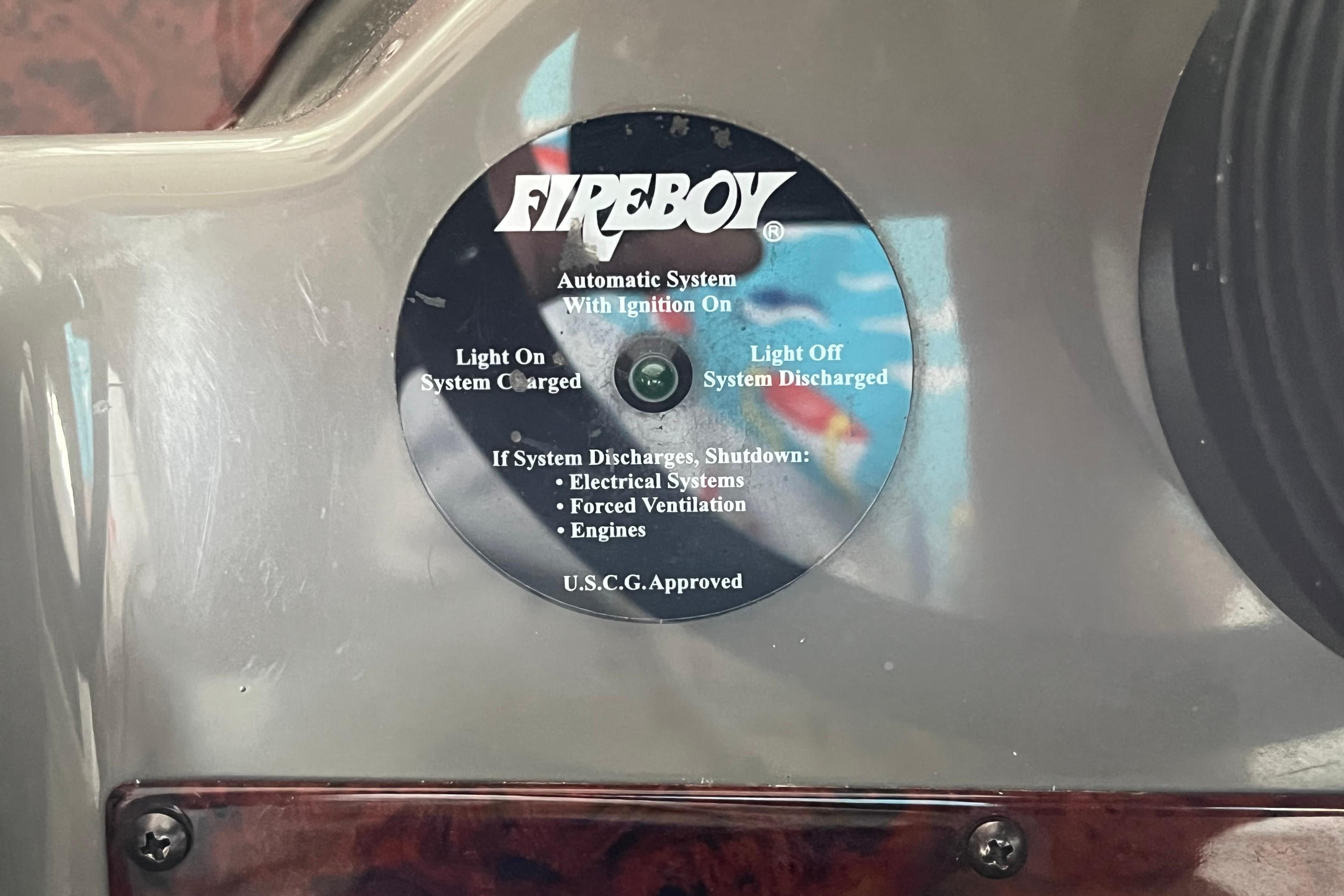 Fireboy automatic system indicator on 2007 Regal 3760 IB Commodore boat dashboard.
