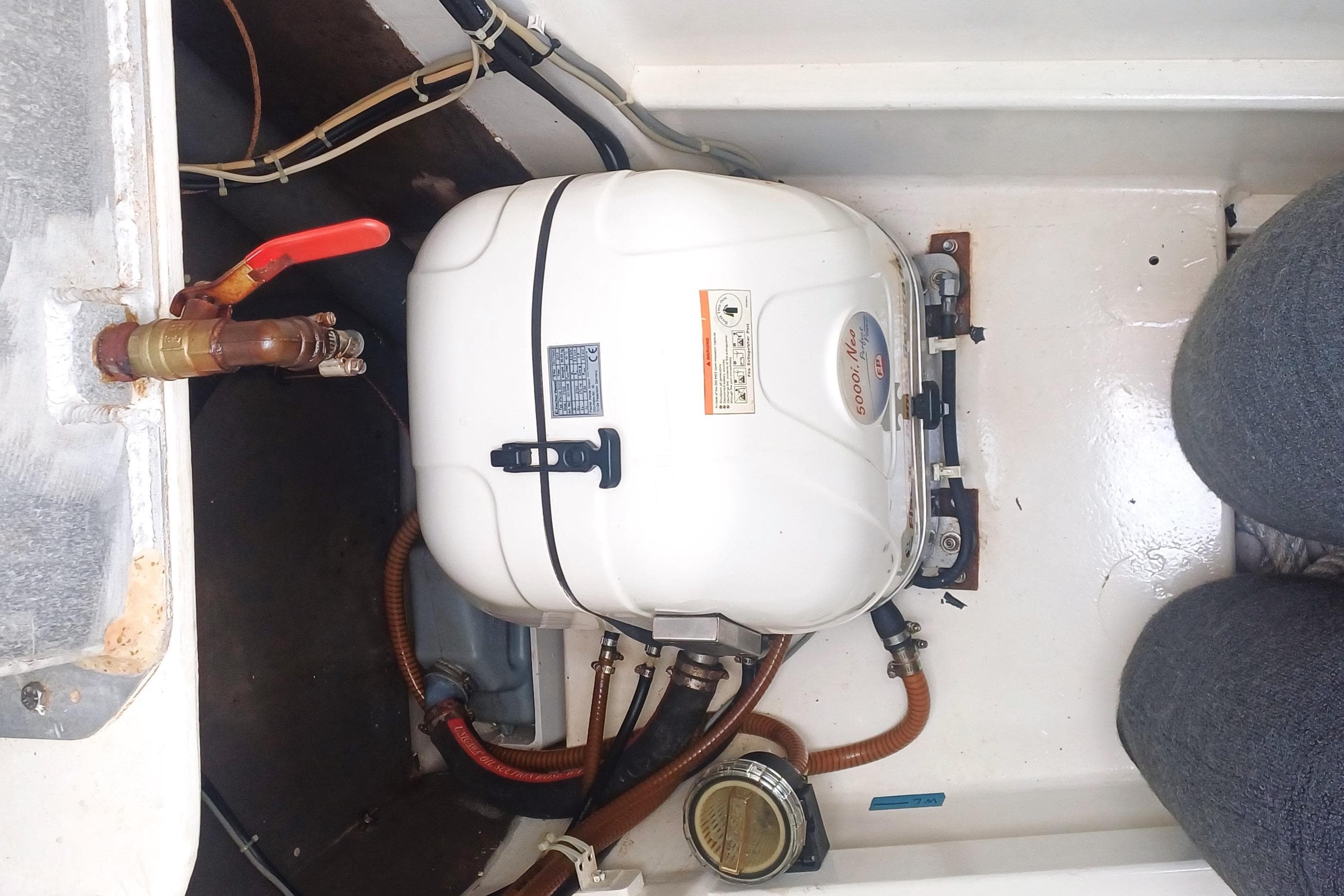 Engine compartment of a 2003 Multicap Caraibes PUNCH 1500 LC boat.