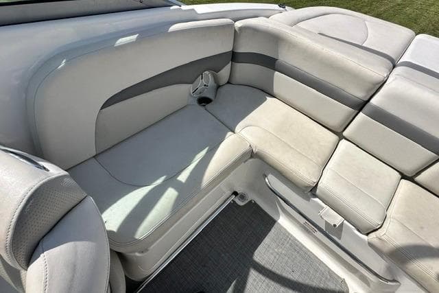 2006 Chaparral 236 SSi boat interior with cushioned seating and cup holder.