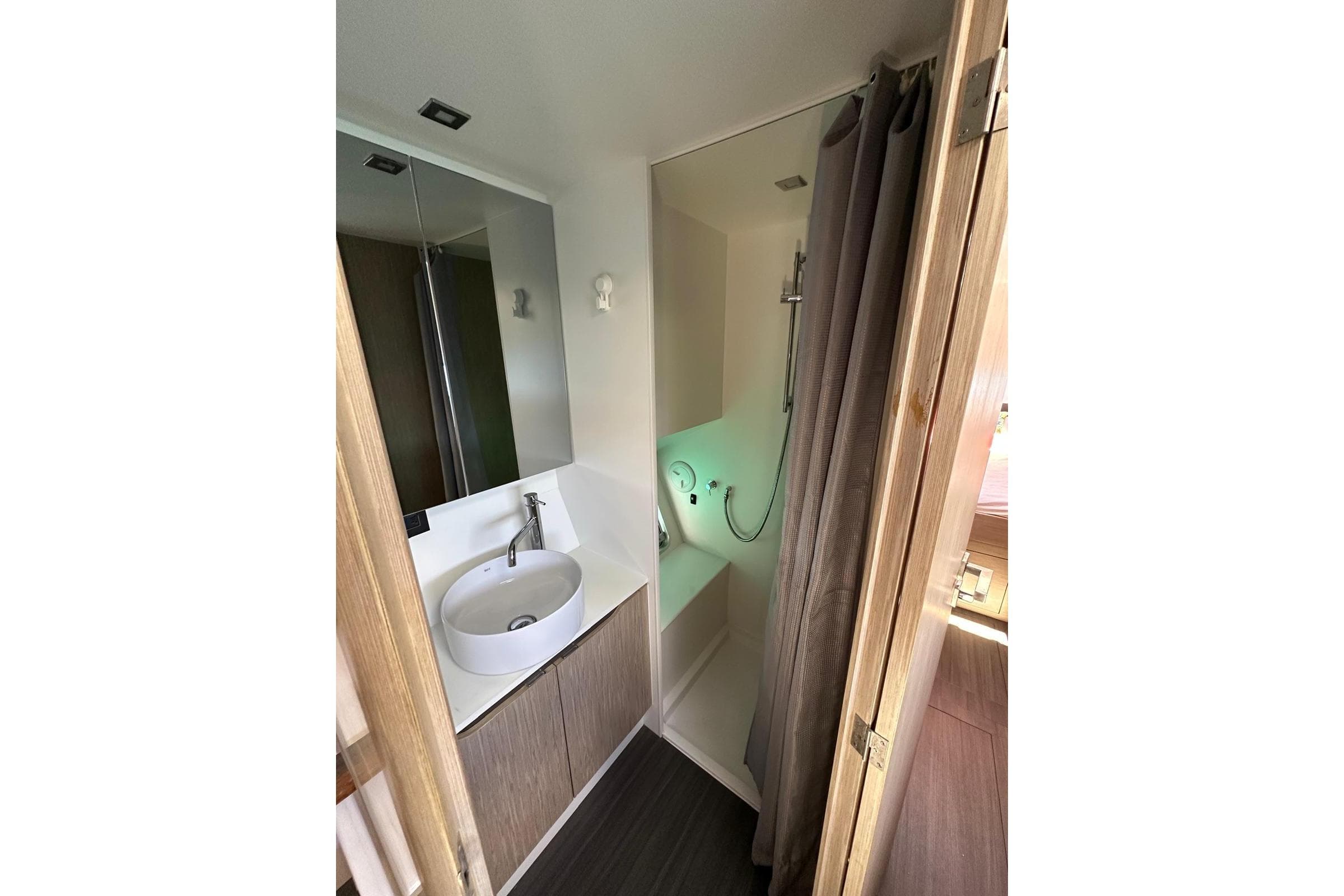 Modern bathroom in 2021 Outremer 55 yacht with sink and shower.