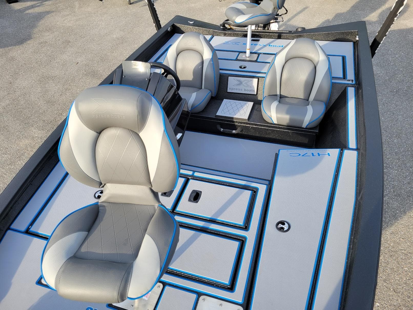 2025 Xpress H17C Crappie boat interior with gray and blue seating, in stock.