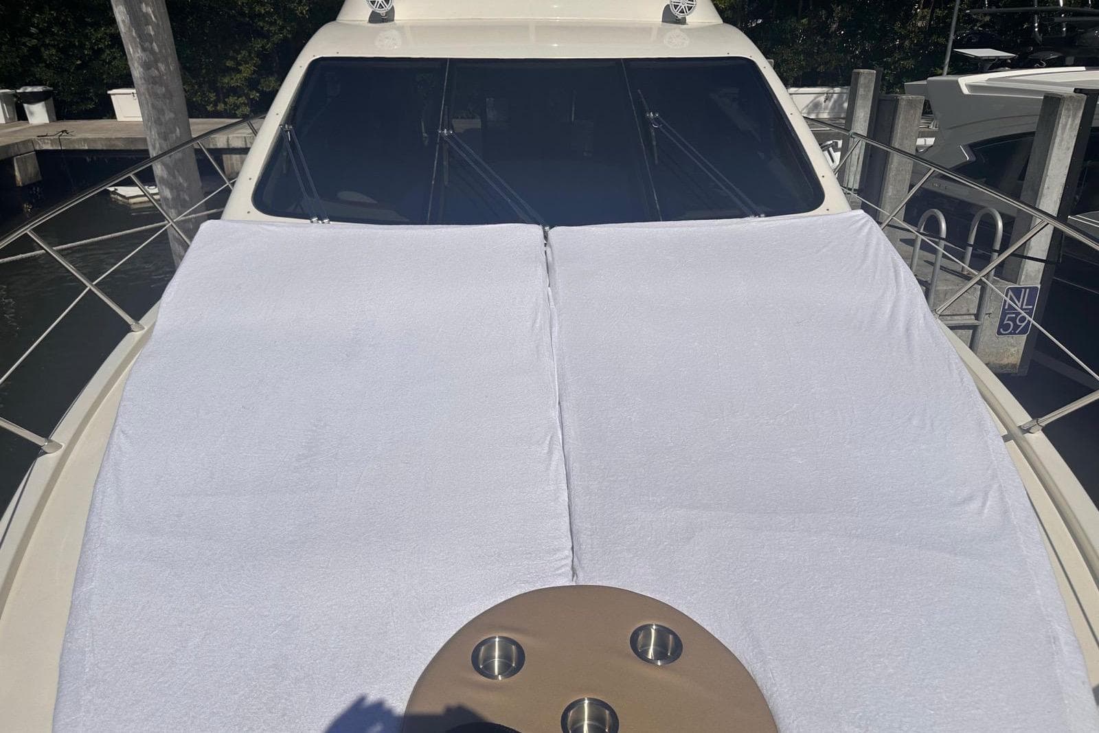 2007 Azimut 55E yacht with sunbathing area covered in white towels.
