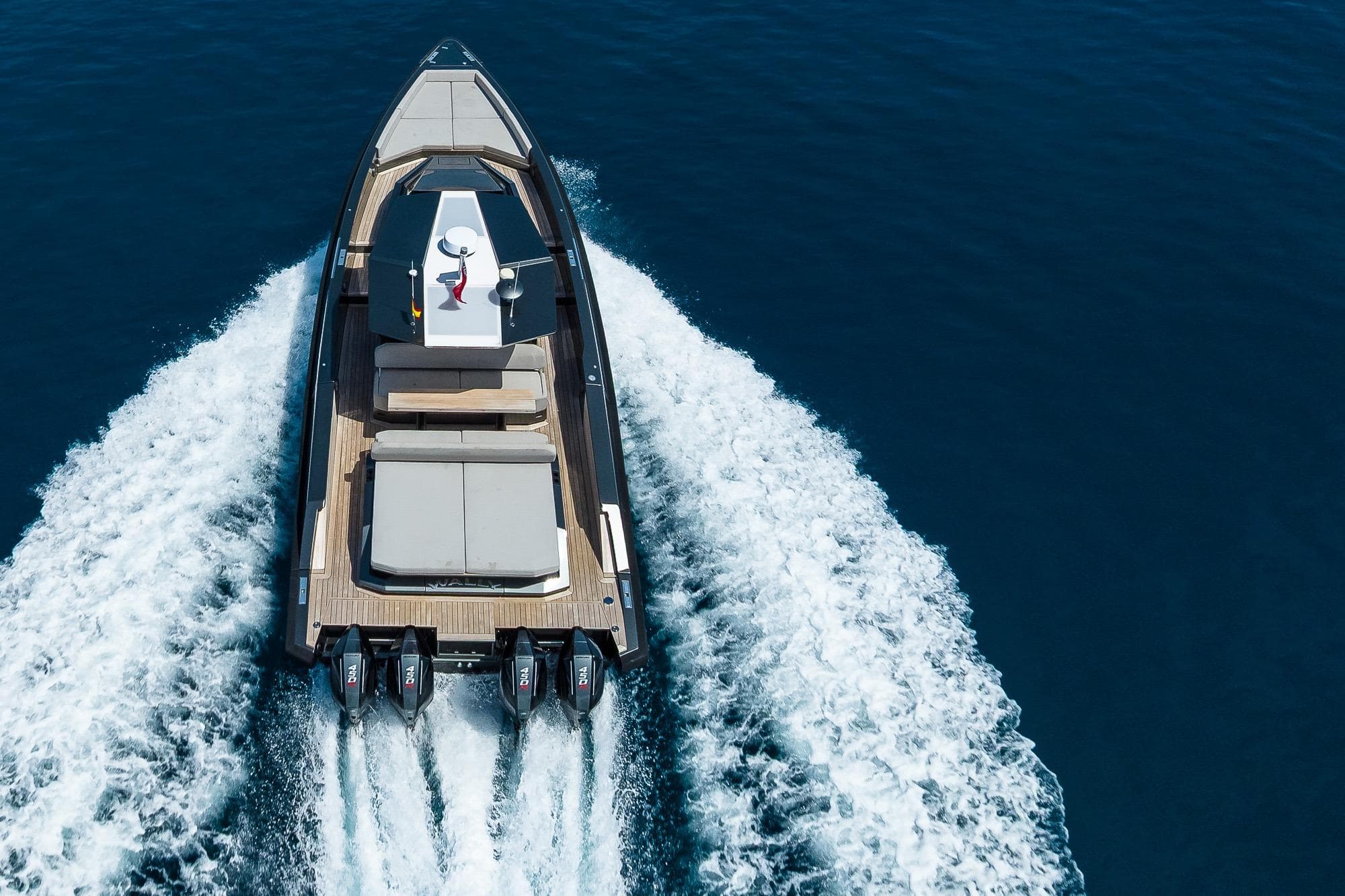 2022 Wally Wallytender 48x yacht cruising on open water, aerial view.
