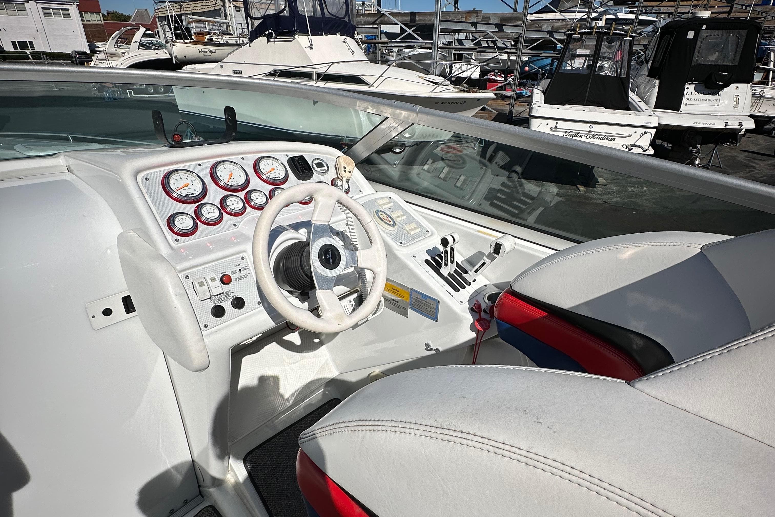 2004 Formula 292 FASTech boat cockpit with steering wheel and gauges.