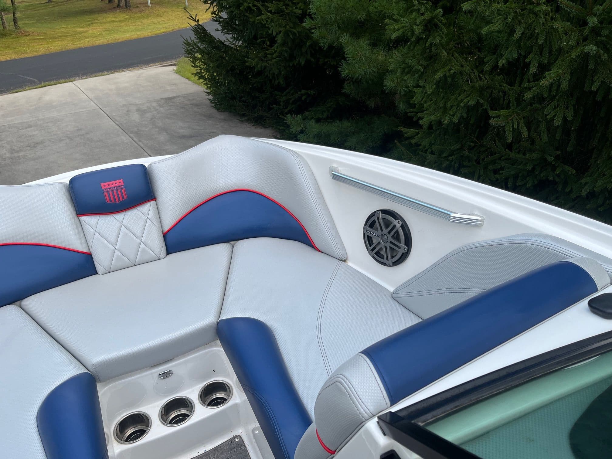 Interior of a 2015 MasterCraft X20 boat with blue and white seating.