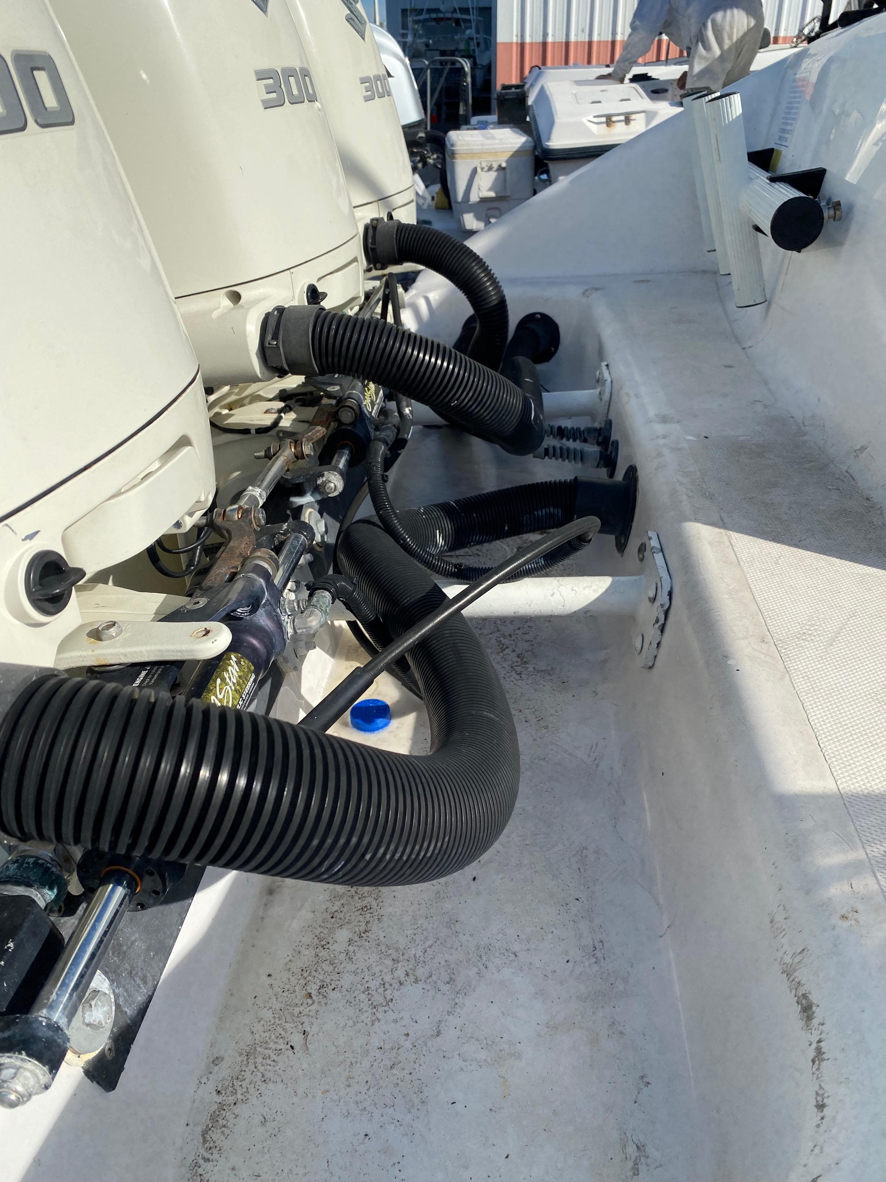 Close-up of 2000 Donzi 35 ZF Open boat engines and hoses.
