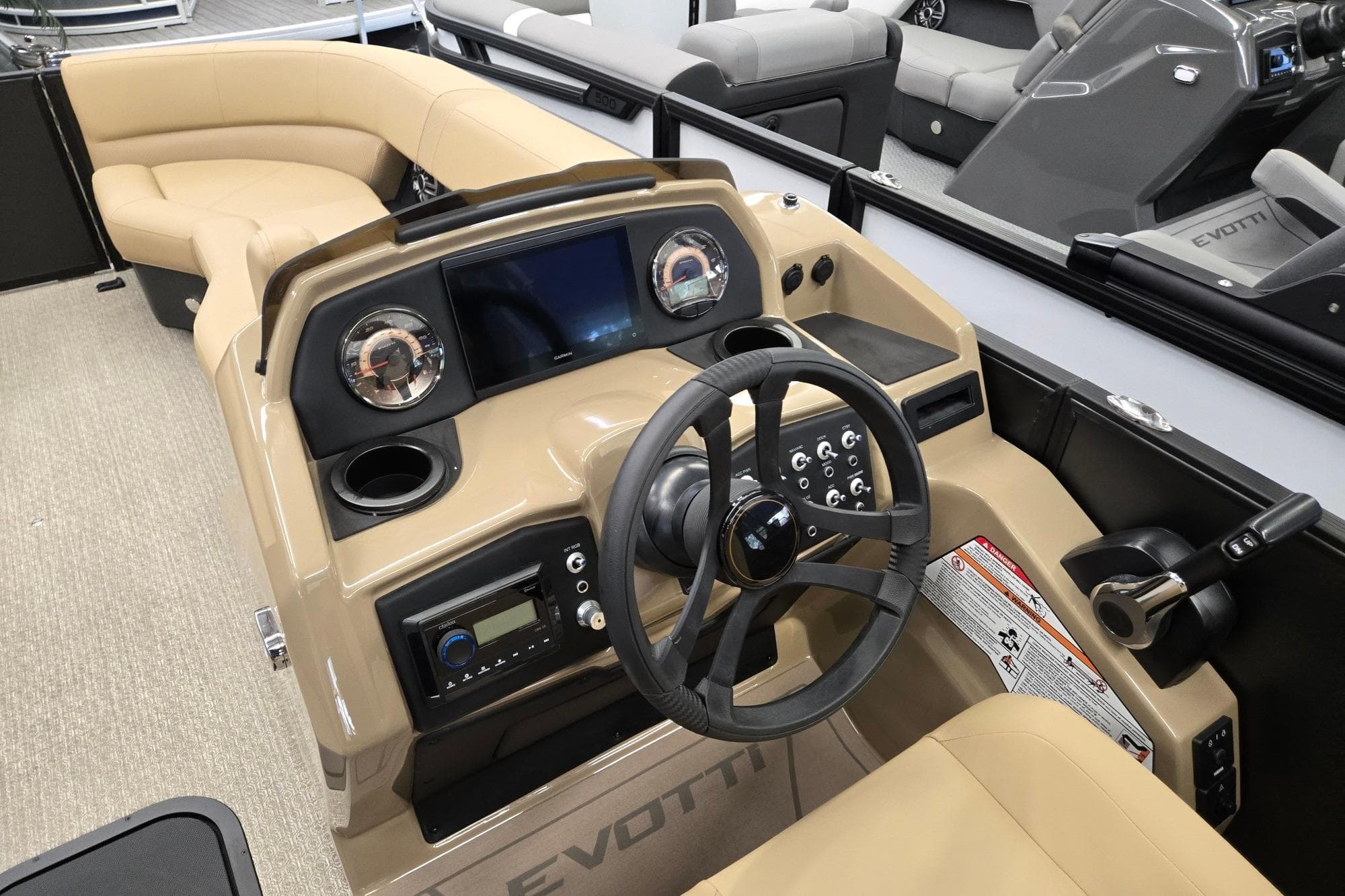 Interior of 2026 Evotti 521QL boat with modern dashboard and steering wheel.