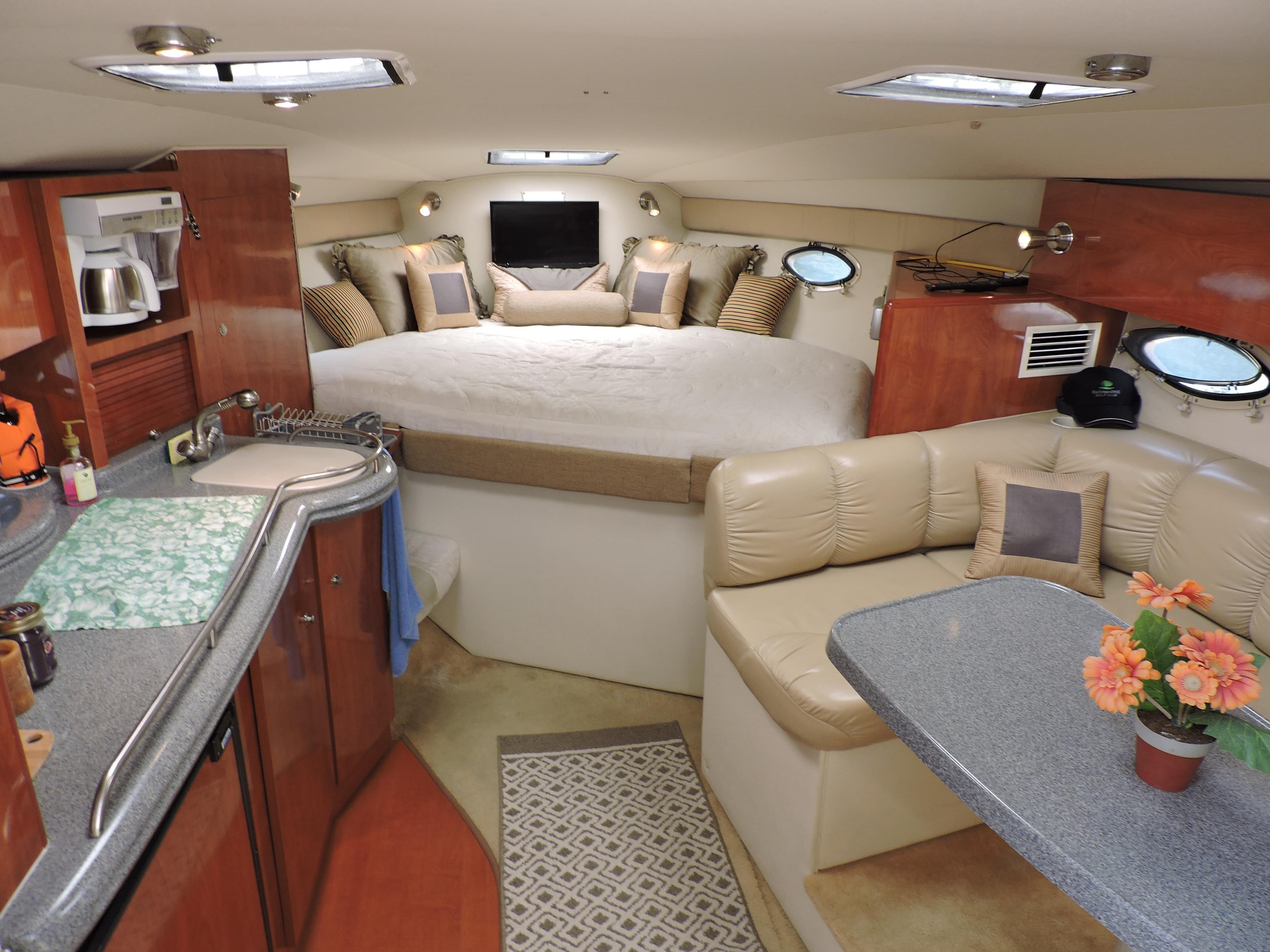 Interior of 2005 Larson 330 CABRIO yacht with cozy seating and modern amenities.