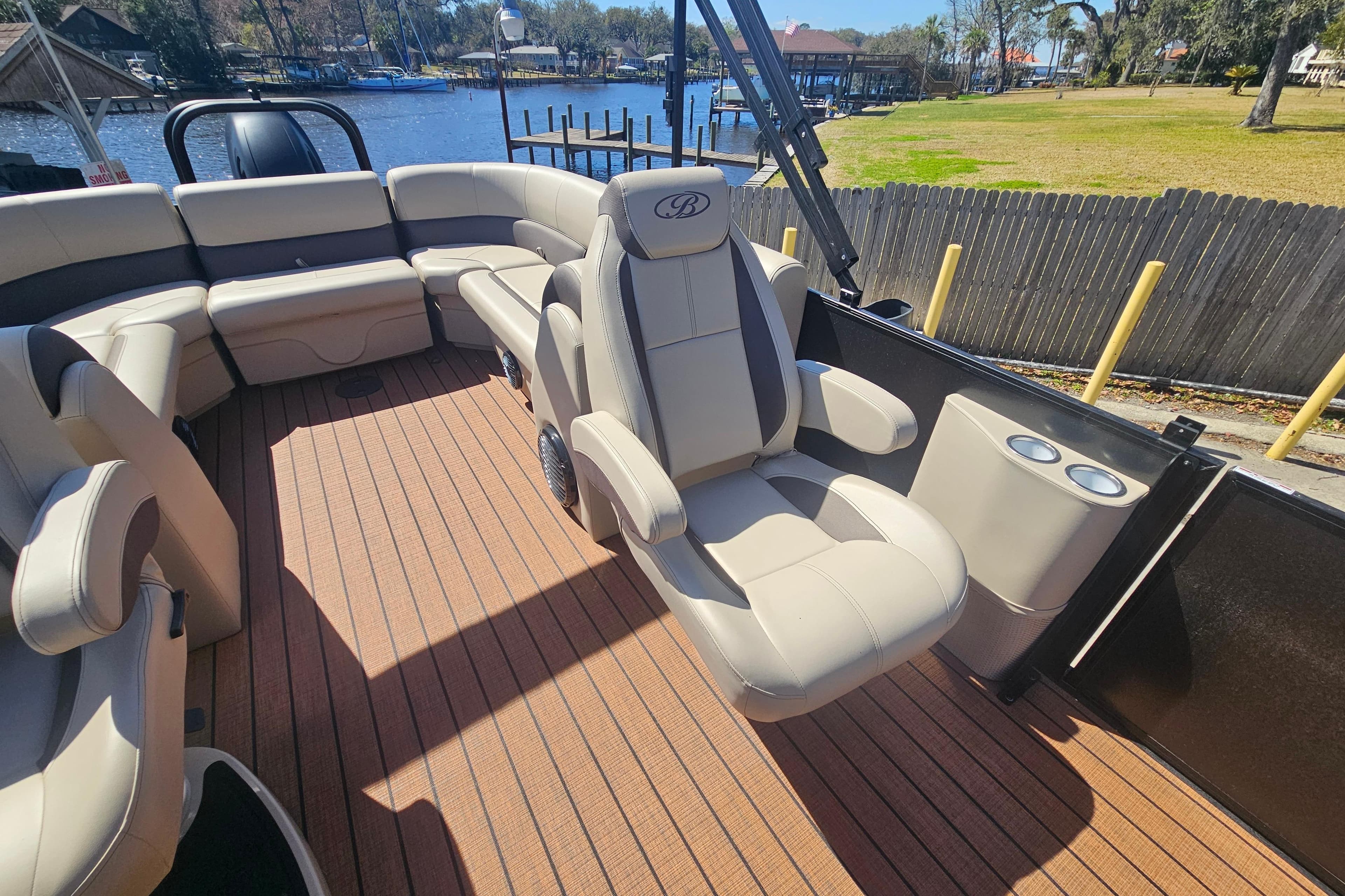 2026 Bentley Pontoons Fish 243 Center Walk Through interior with luxurious seating and cup holders.