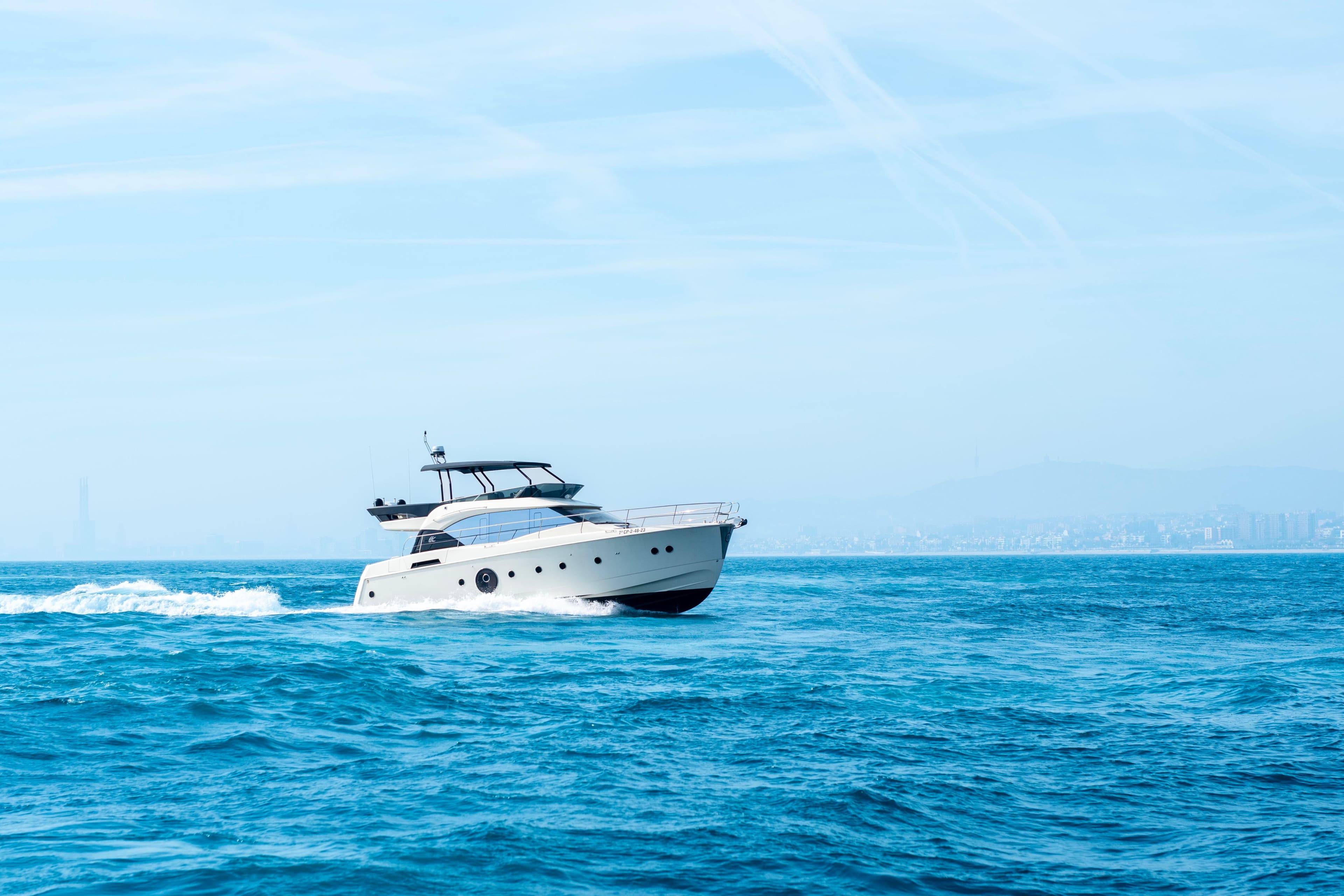 2018 Beneteau Monte Carlo 6 yacht cruising on open blue sea.