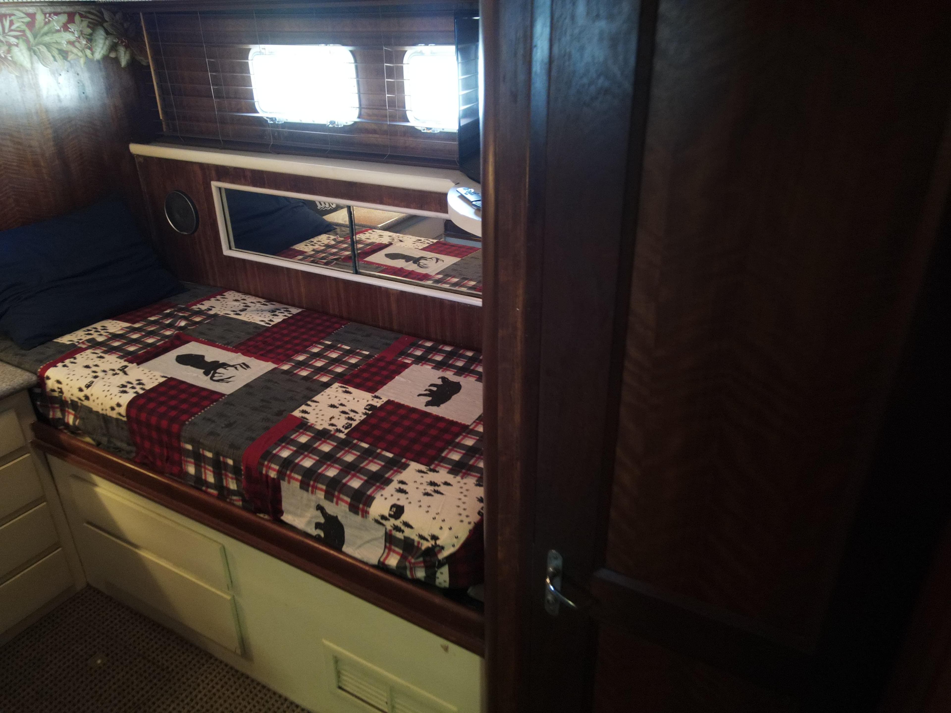Interior of 1979 Hatteras 58 Cockpit Motor Yacht with cozy bed.