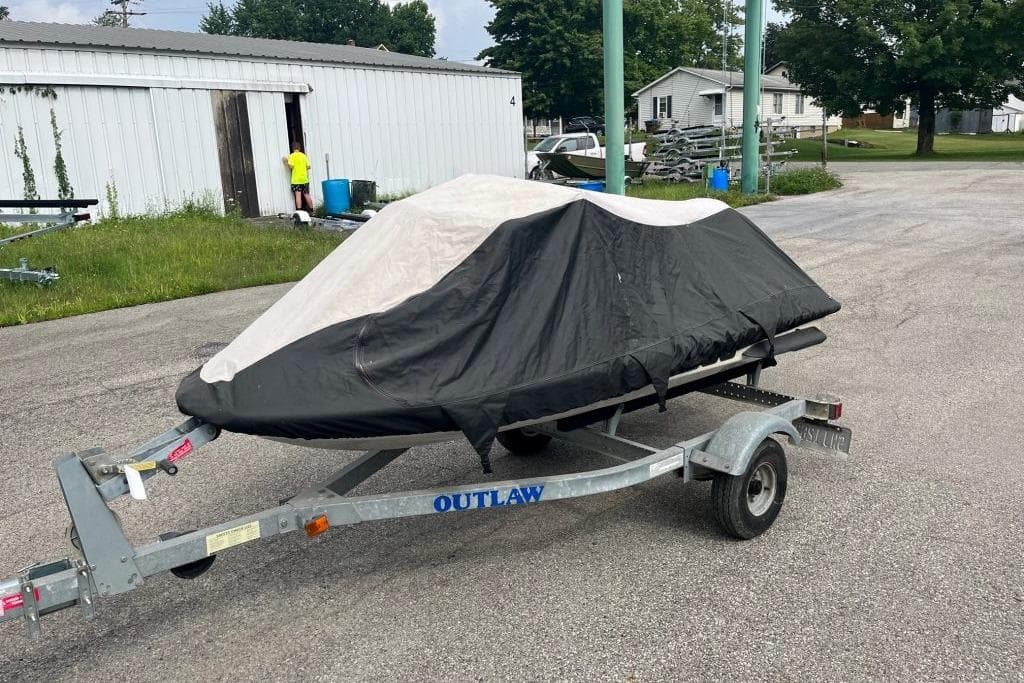 Covered 2001 Sea-Doo GTX on trailer in outdoor setting.
