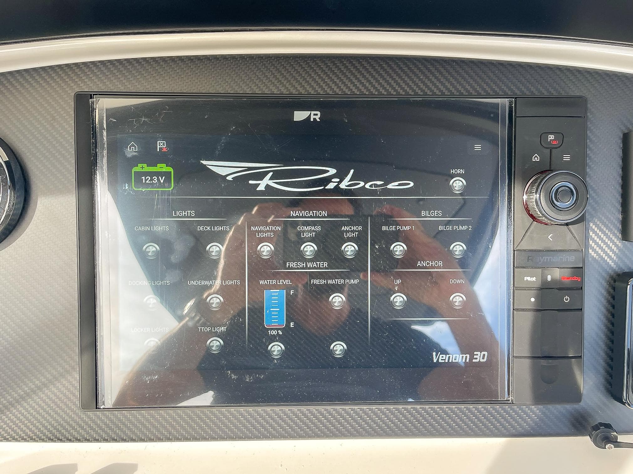 Control panel of 2025 Ribco Venom 30 boat with touchscreen interface.