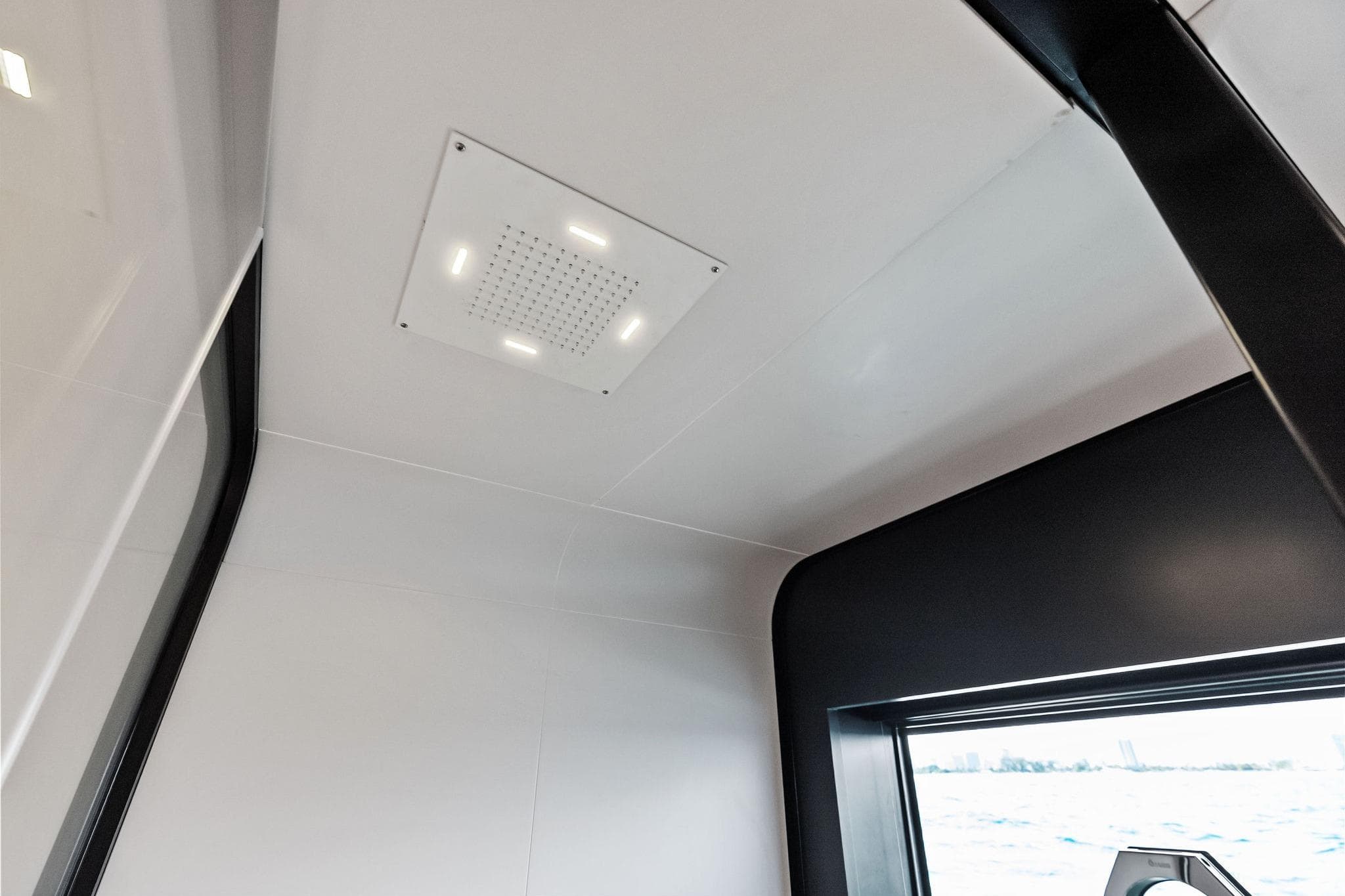 Interior view of 2025 Wally Wallytender 100 yacht, featuring modern ceiling design.