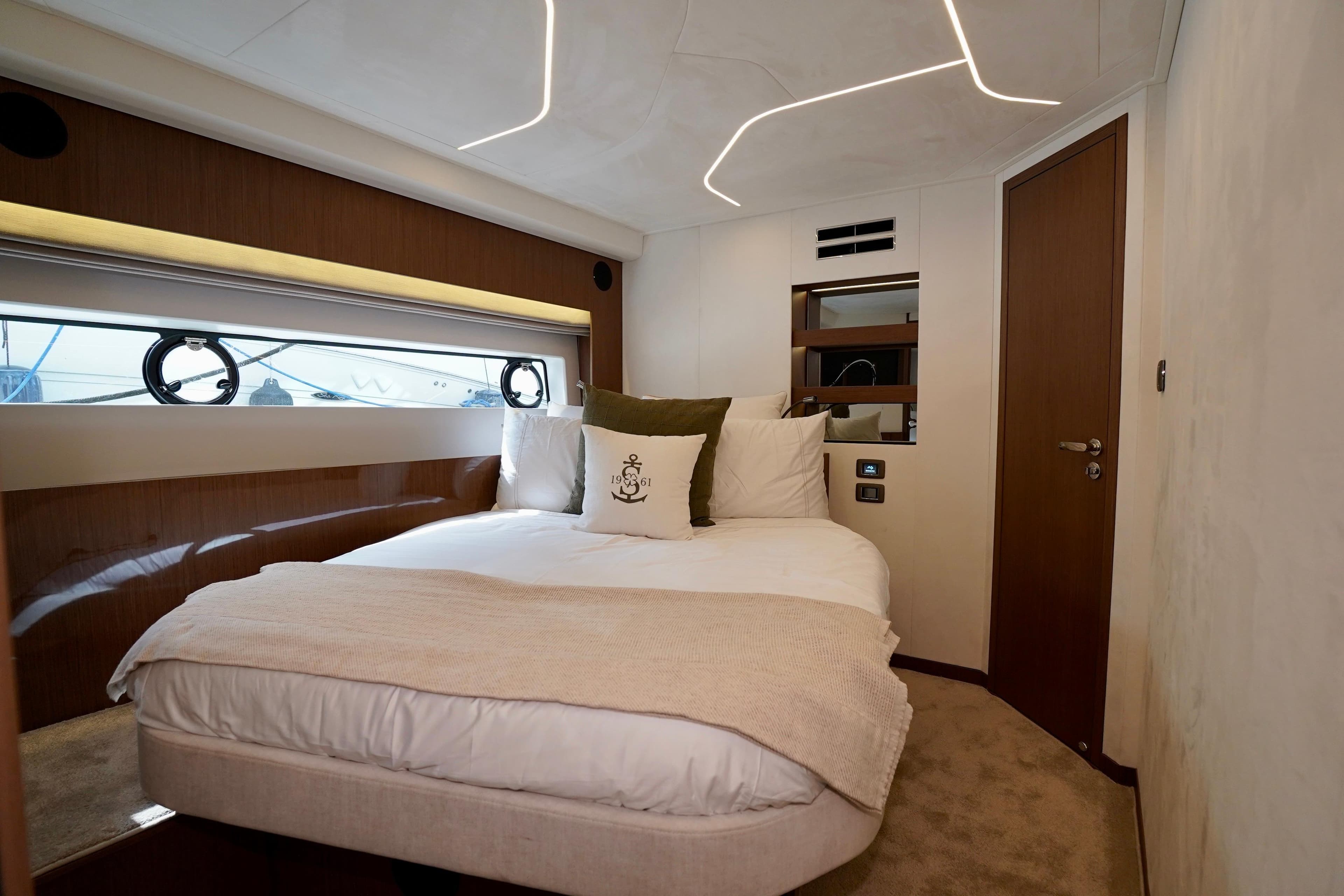 Luxurious bedroom interior of 2025 Prestige F5.7 yacht with modern design.