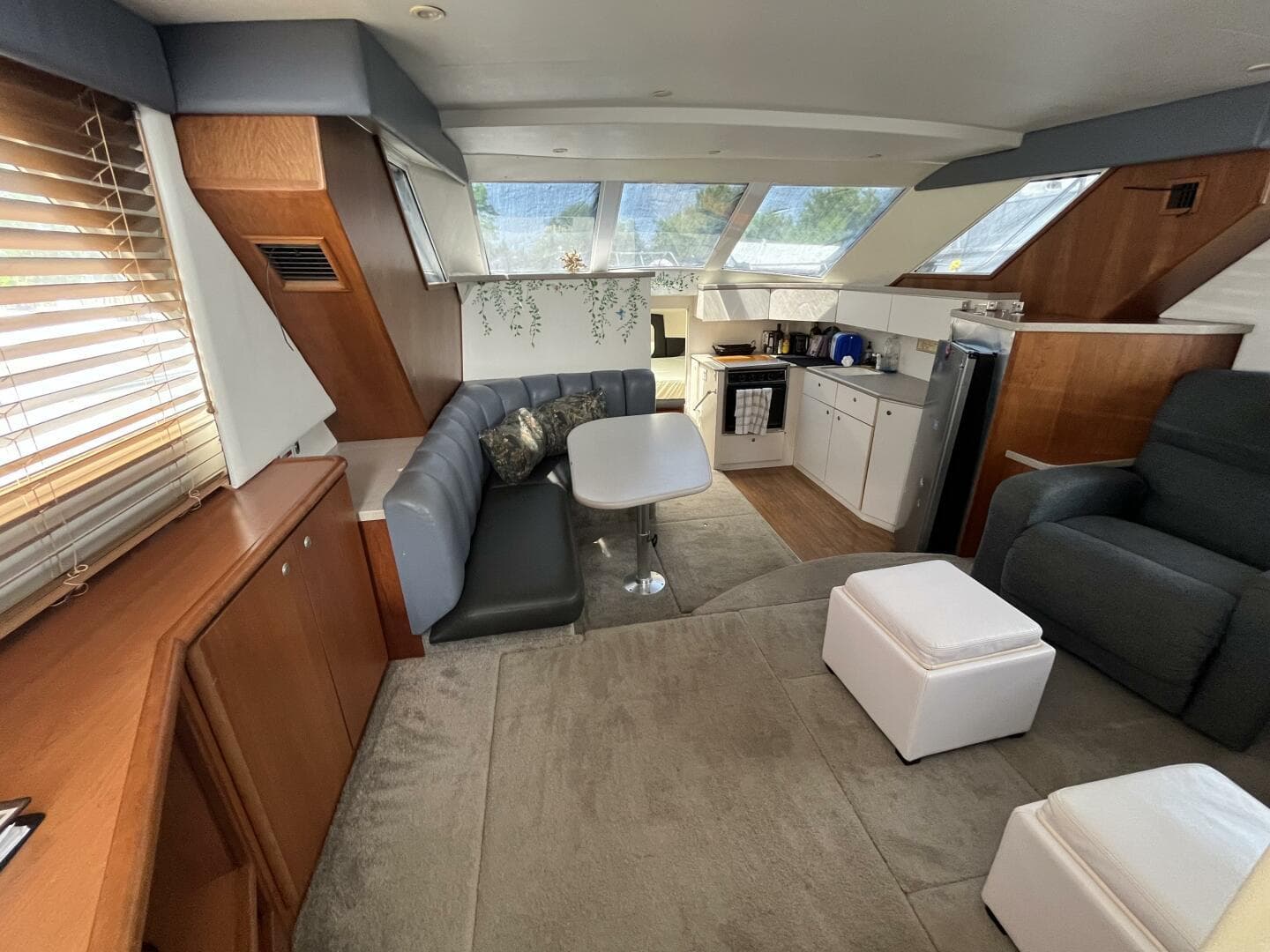 Interior of 1996 Silverton 372 Signature yacht with modern seating and kitchen area.