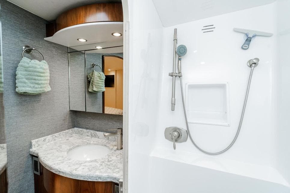 Luxurious bathroom in 2021 Viking 58 Convertible yacht with modern fixtures and elegant design.