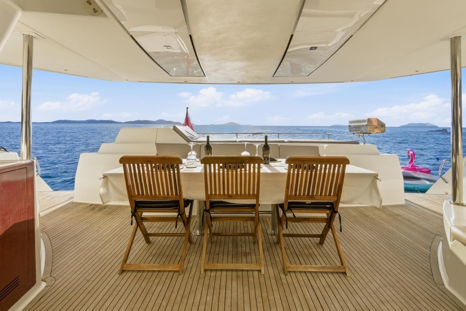 Luxury dining area on 2013 Fountaine Pajot Sanya 57 yacht with ocean view.