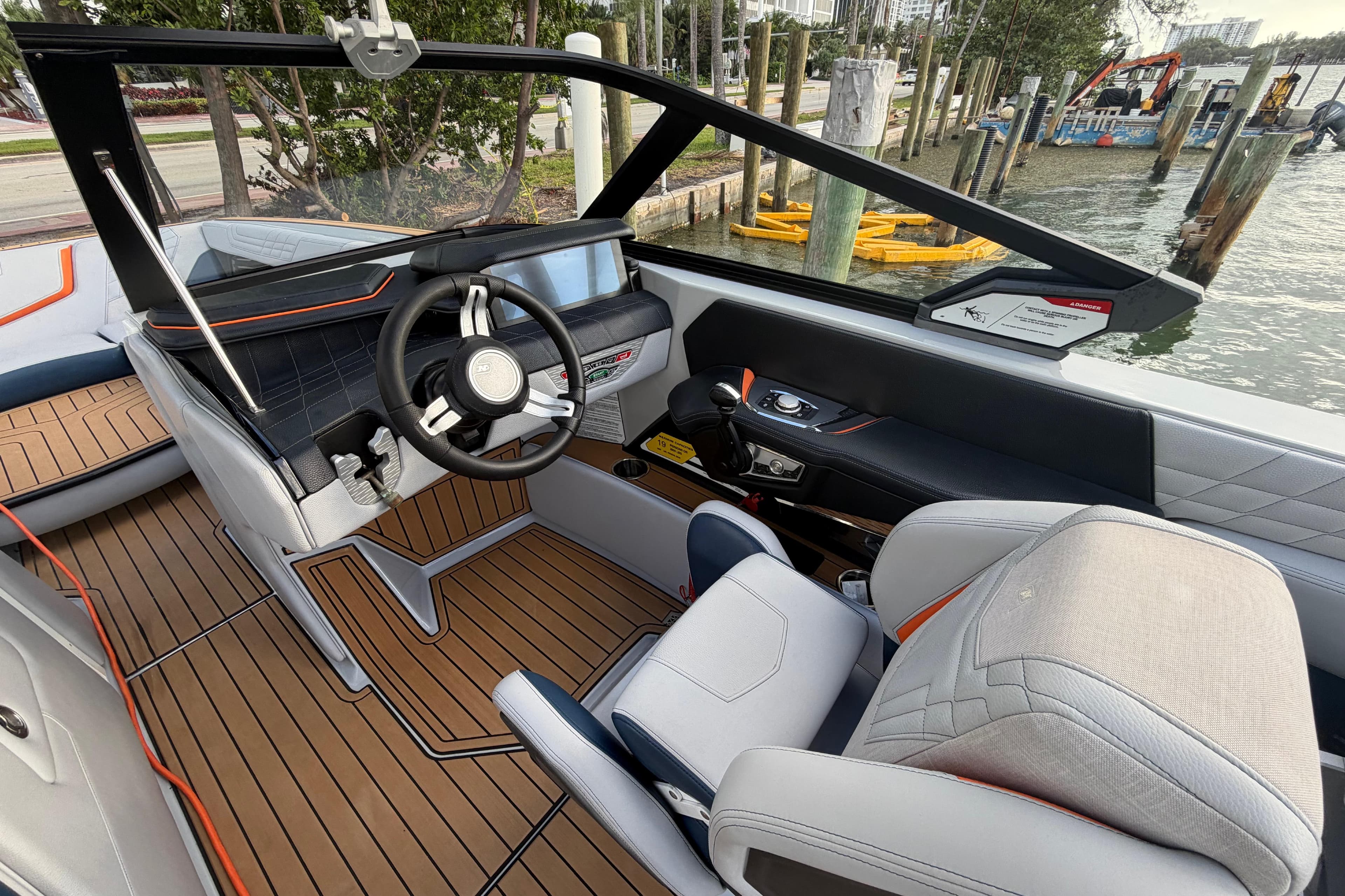 2022 Nautique Super Air Nautique G25 interior with modern dashboard and luxurious seating.