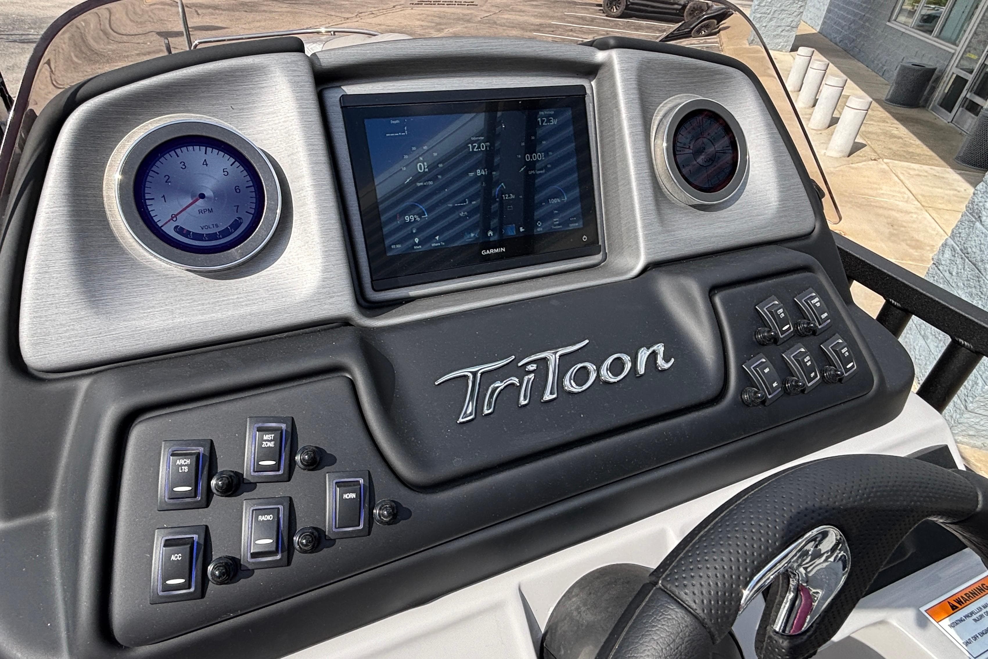 2026 JC Sporttoon 26TT dashboard with digital display and control switches.