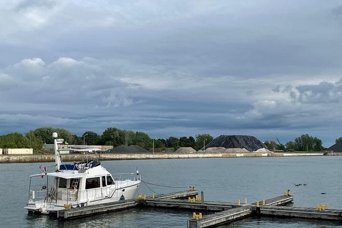Island Pilot 395 yacht docked at a marina, cloudy sky, 2007 model.