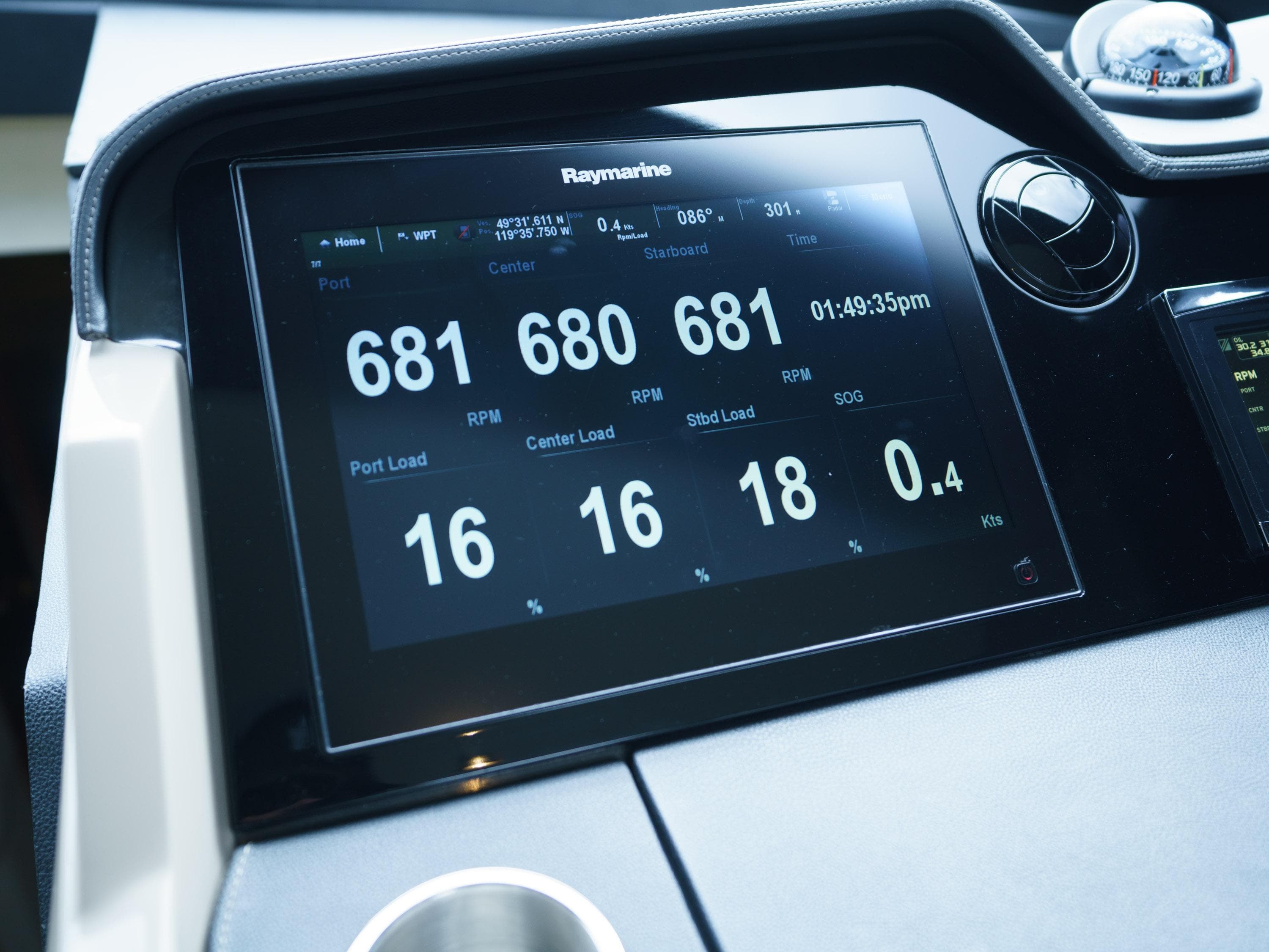 Digital dashboard display on 2016 Sea Ray L590 yacht, showing RPM and load metrics.