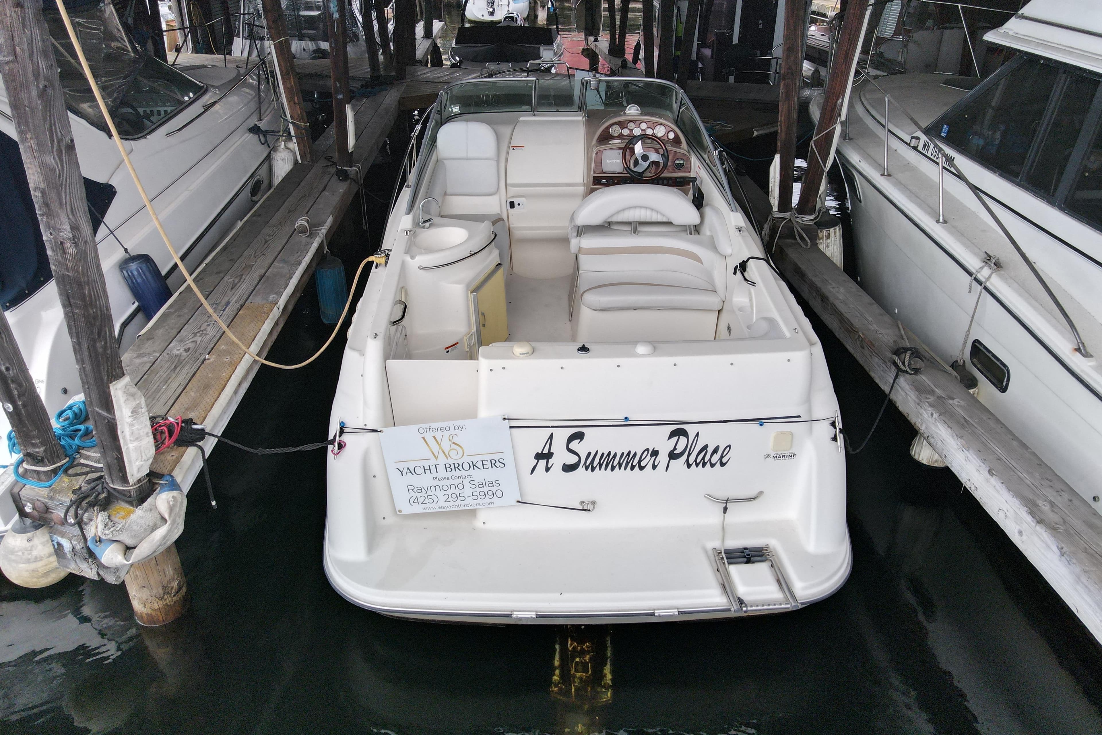 2007 Glastron GS 279 boat docked in marina.
