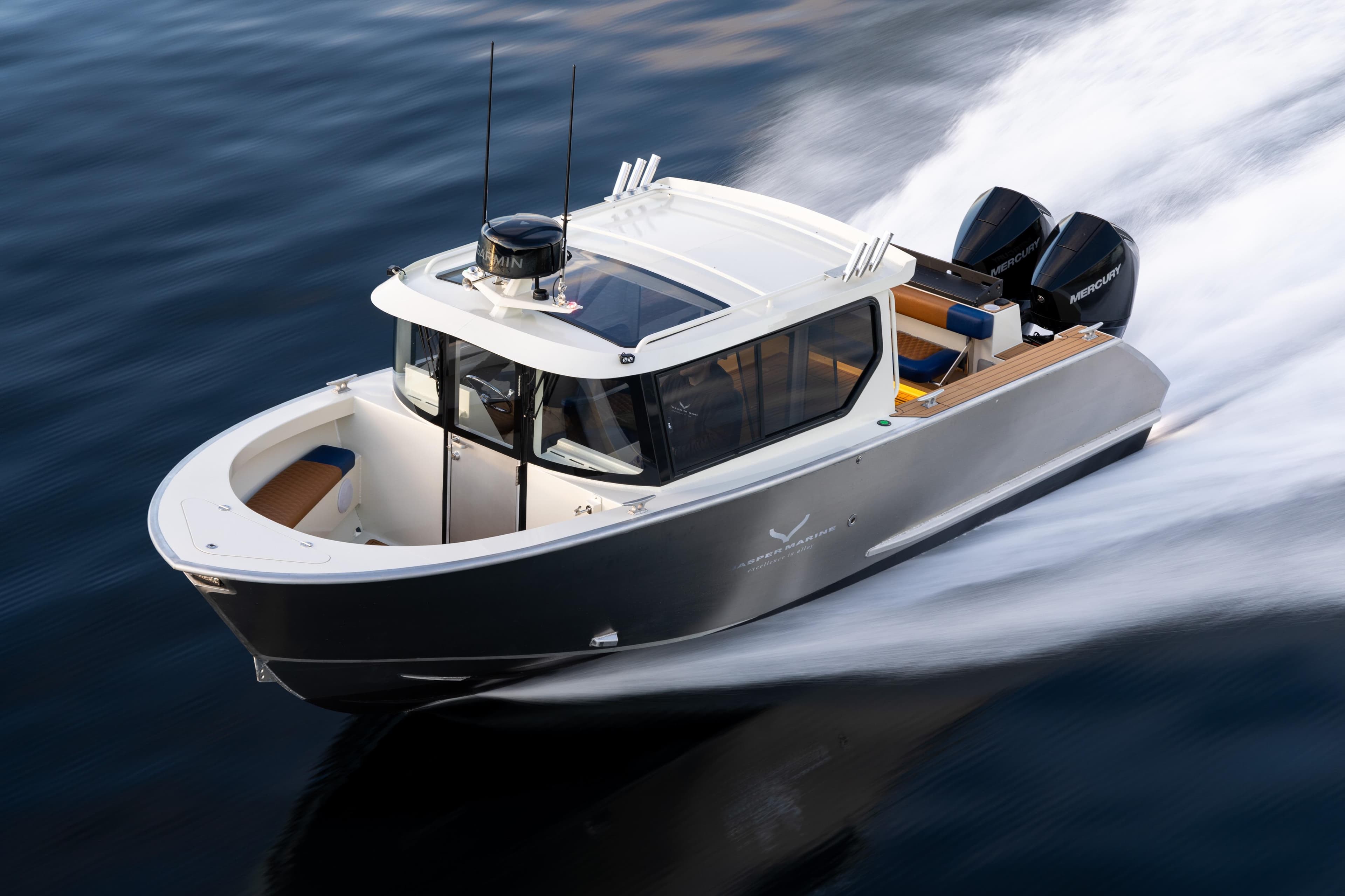 2026 Jasper Marine Defender 22 speeding on water, showcasing sleek design and powerful engines.