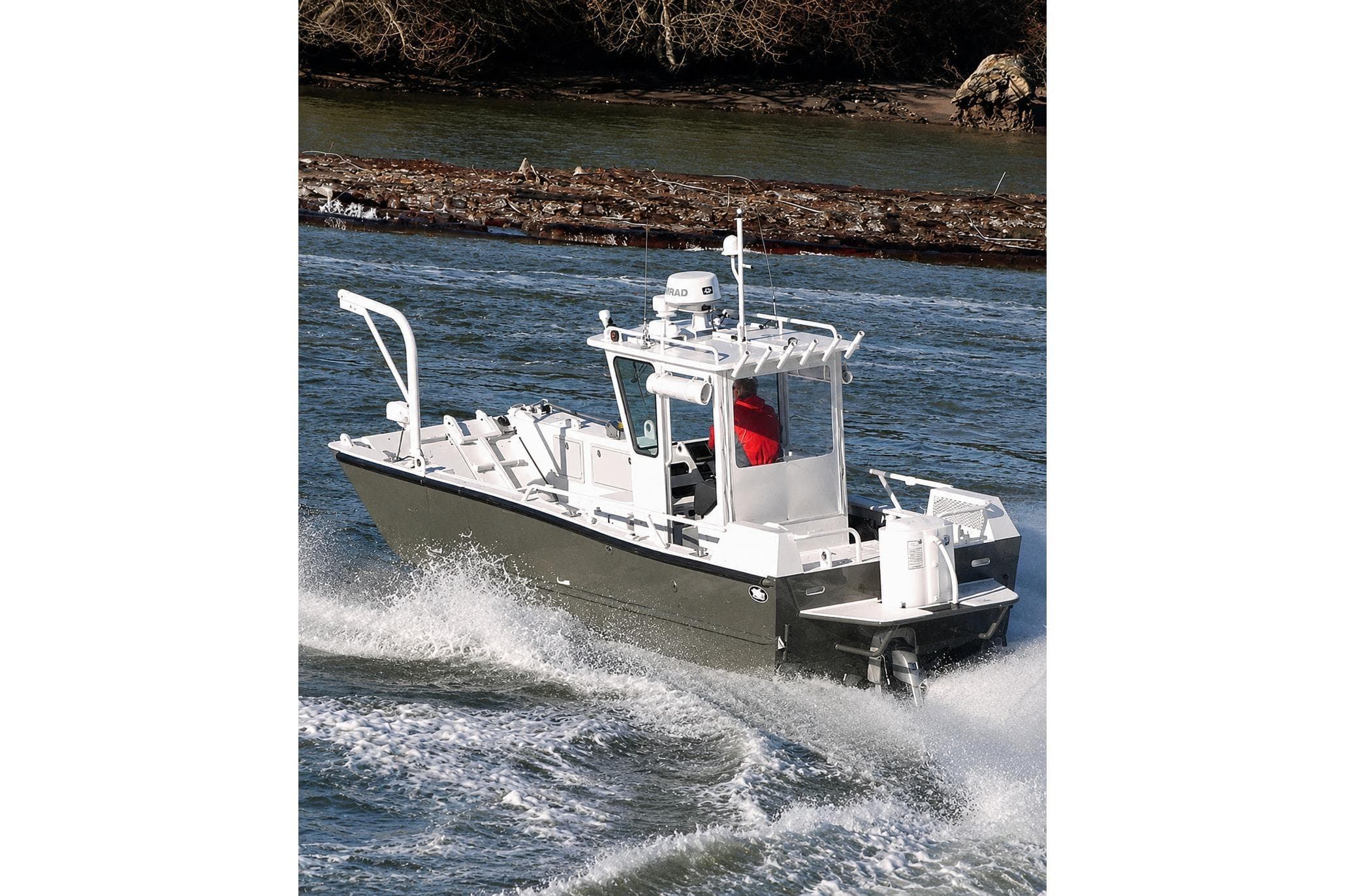 Munson 24 boat cruising on water, 2015 model, with a person onboard.