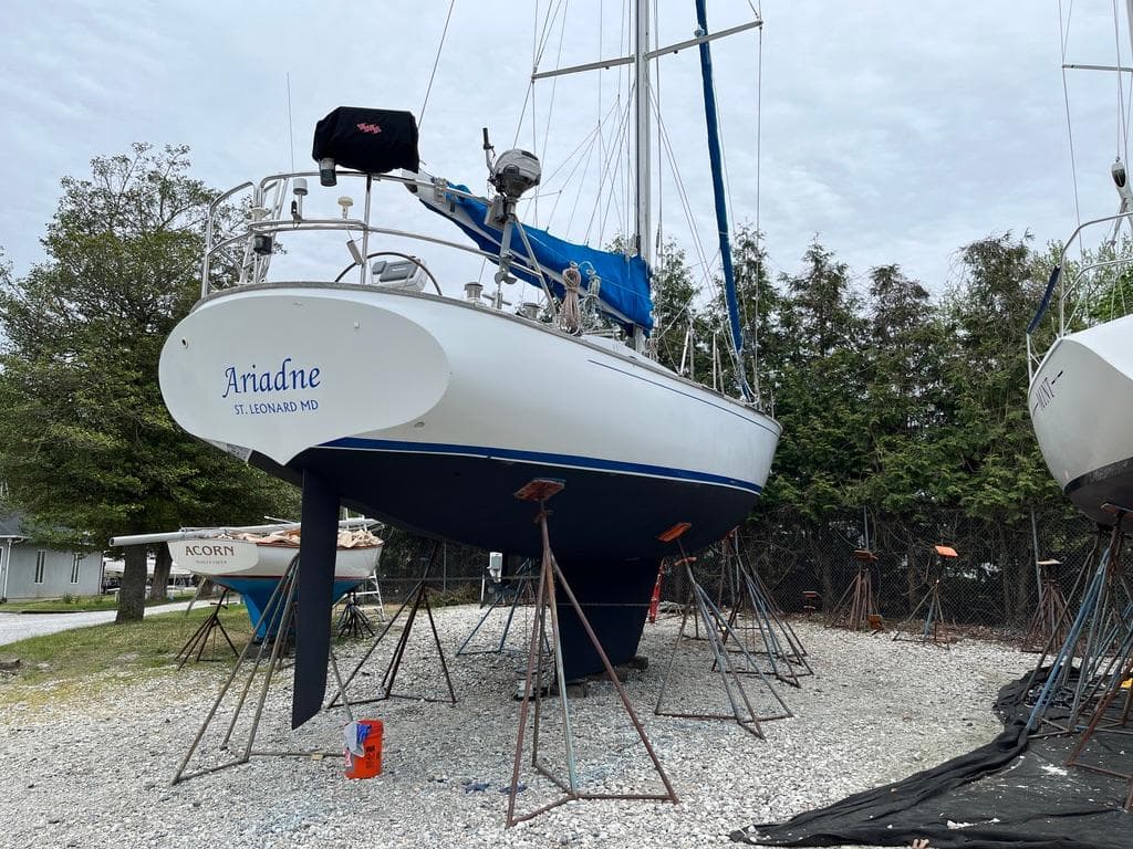 Sailboat "Ariadne" on stands, ShearWater 45 model, 2004, in a boatyard setting.
