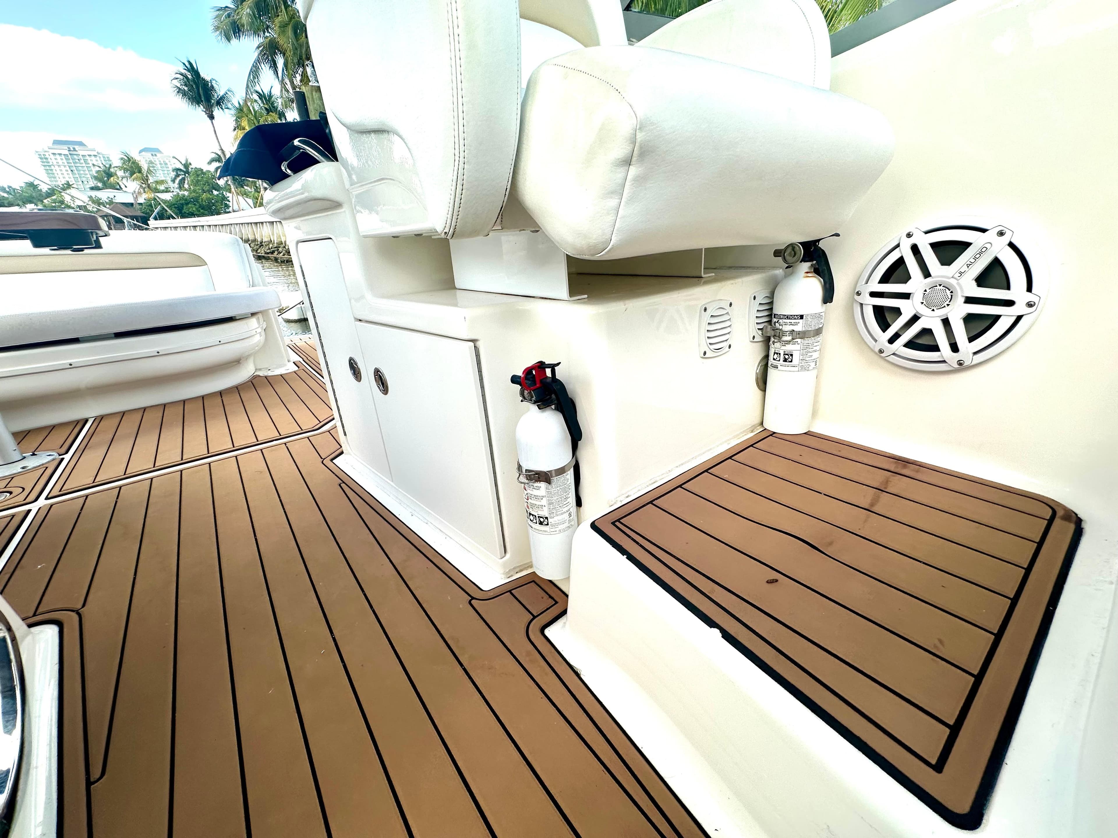 2008 Sea Ray 420 Sundancer boat interior with teak flooring and white seating.