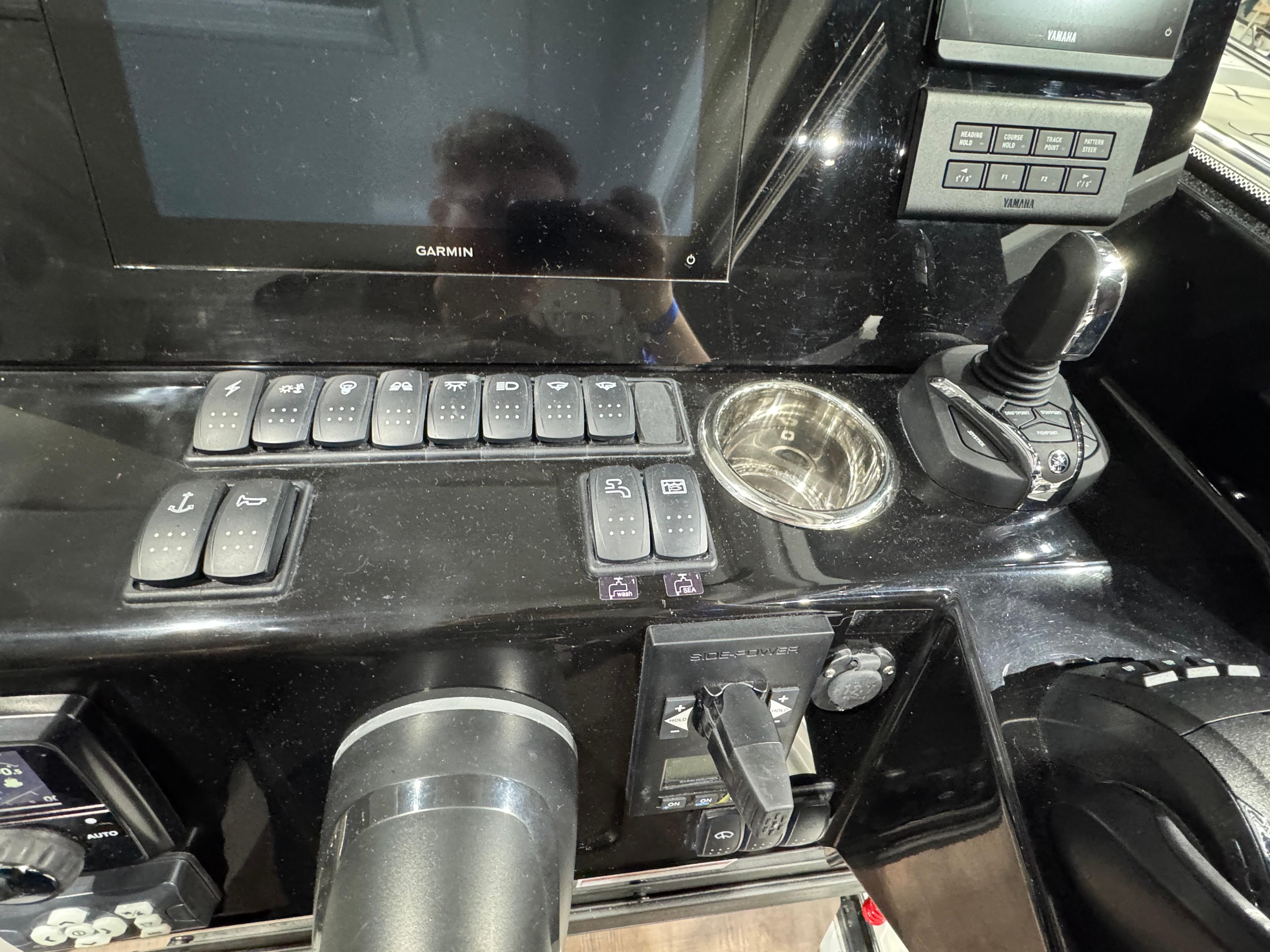 Control panel of 2025 Jeanneau NC 895 Sport Series 2 boat with joystick and switches.
