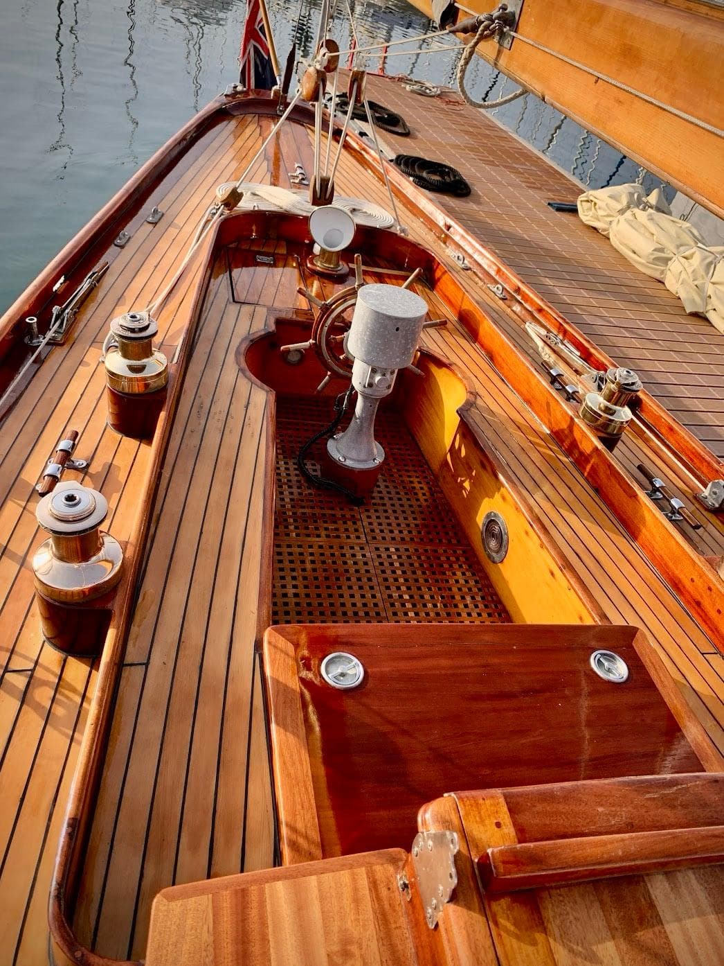 1940 William Fife Vintage Bermudan Cutter with polished wooden deck and classic nautical features.