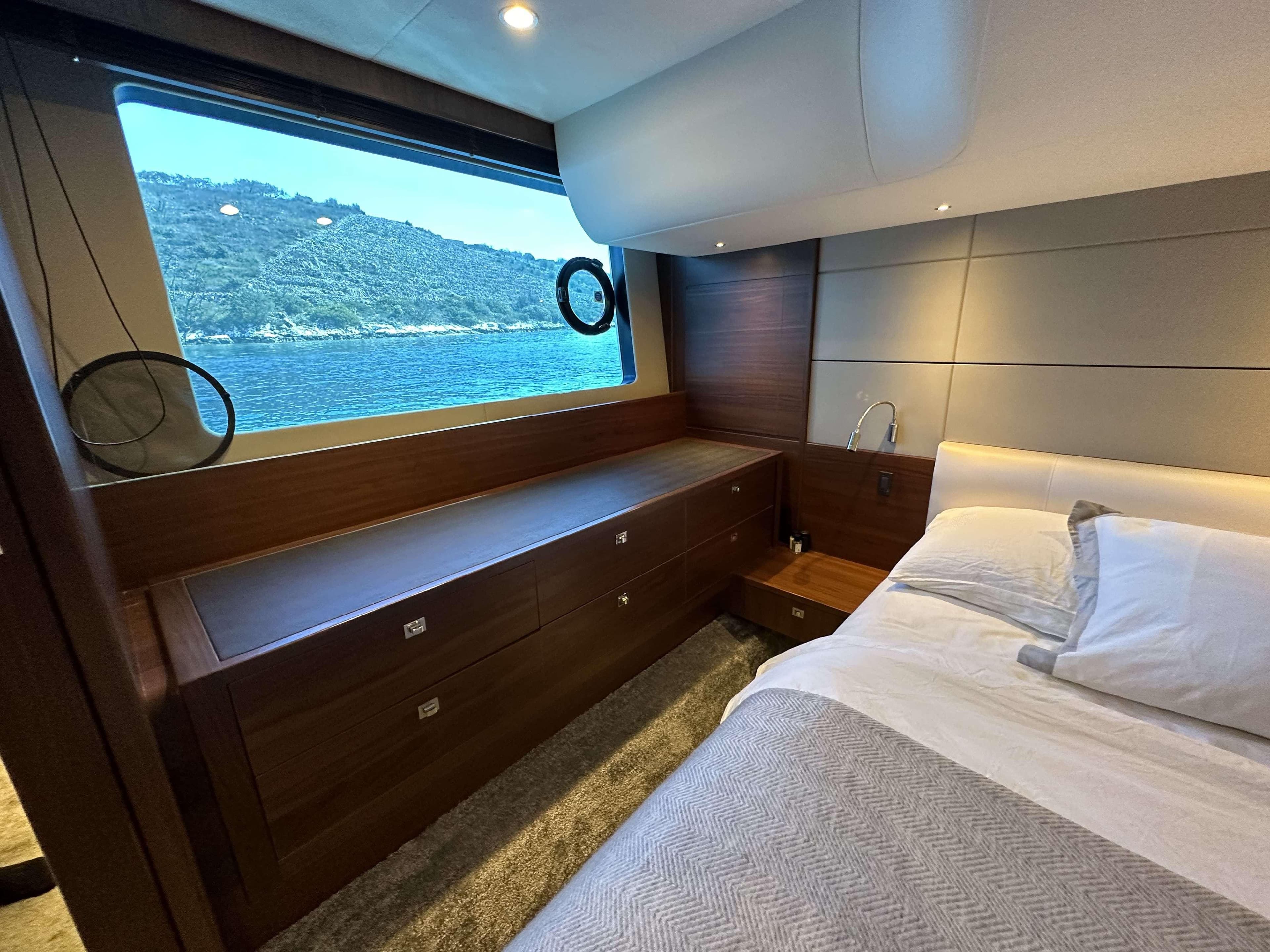 Luxurious cabin interior of 2014 Princess 60 yacht with scenic ocean view.