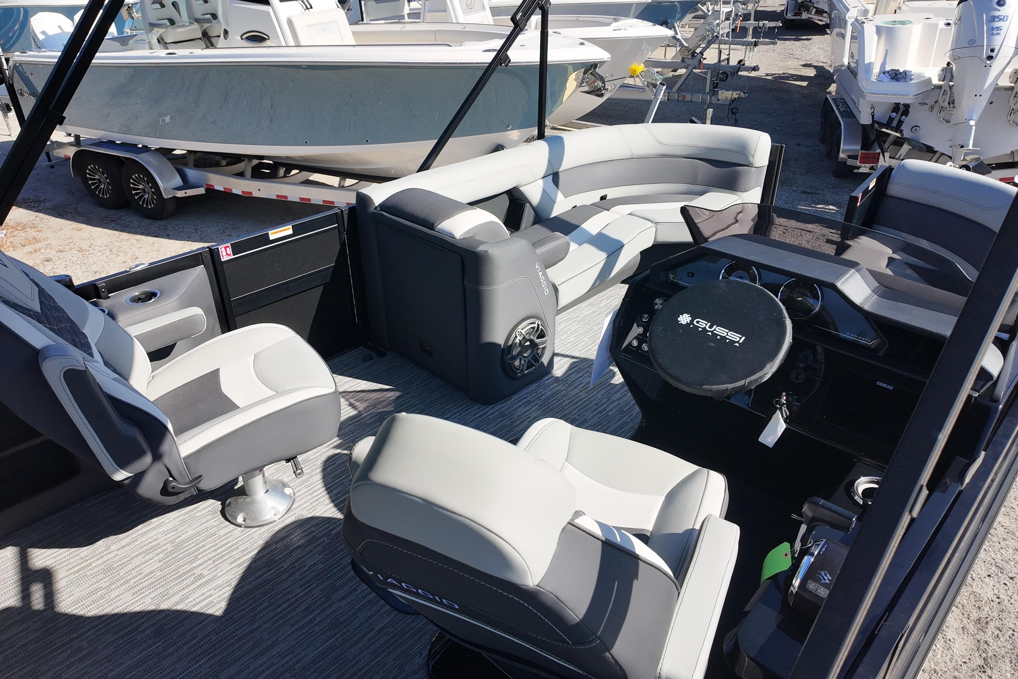 Interior of 2026 Viaggio Diamante S 22 boat with modern seating and steering console.