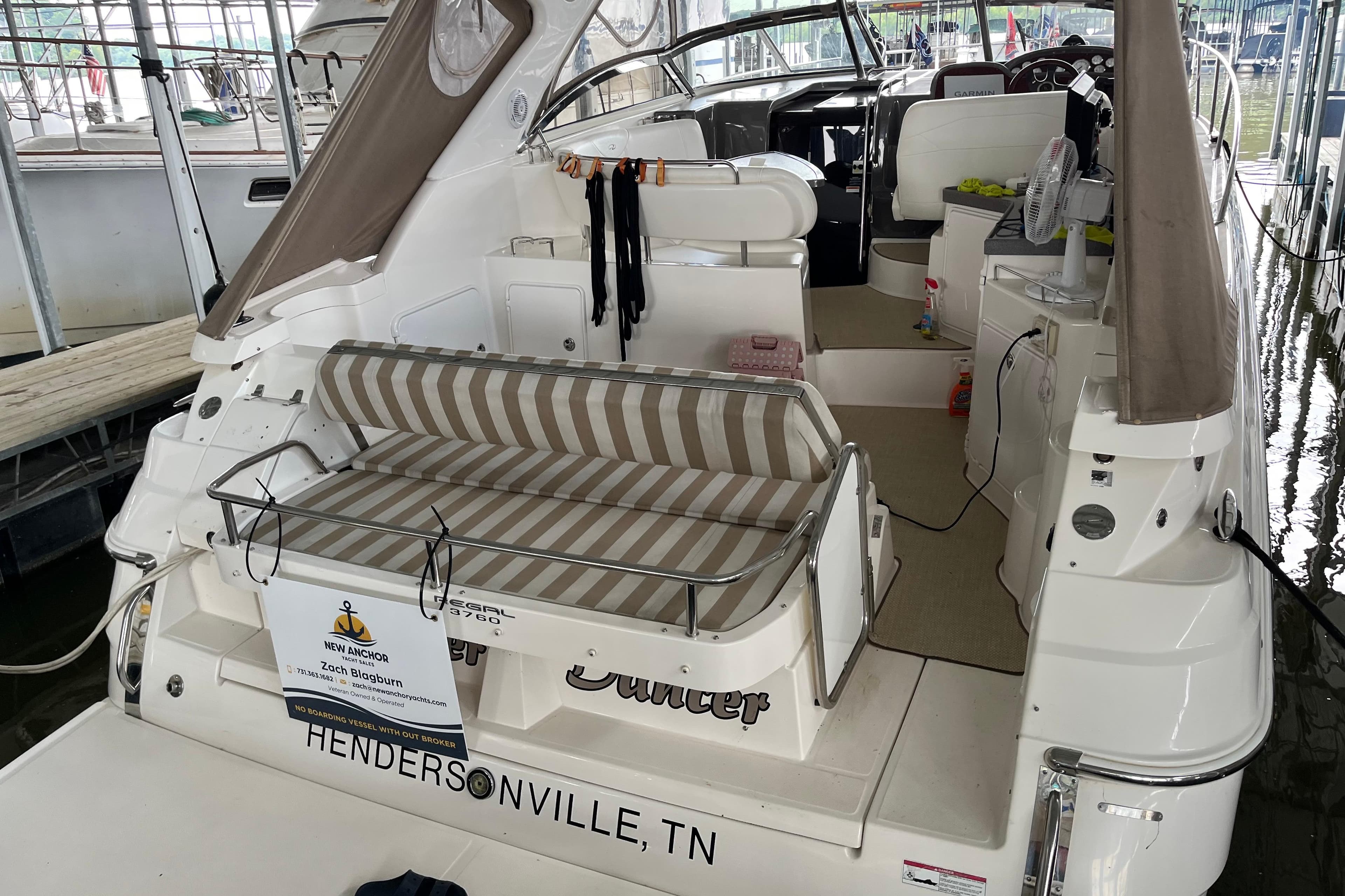 2007 Regal 3760 IB Commodore yacht with striped seating, docked in Hendersonville, TN.