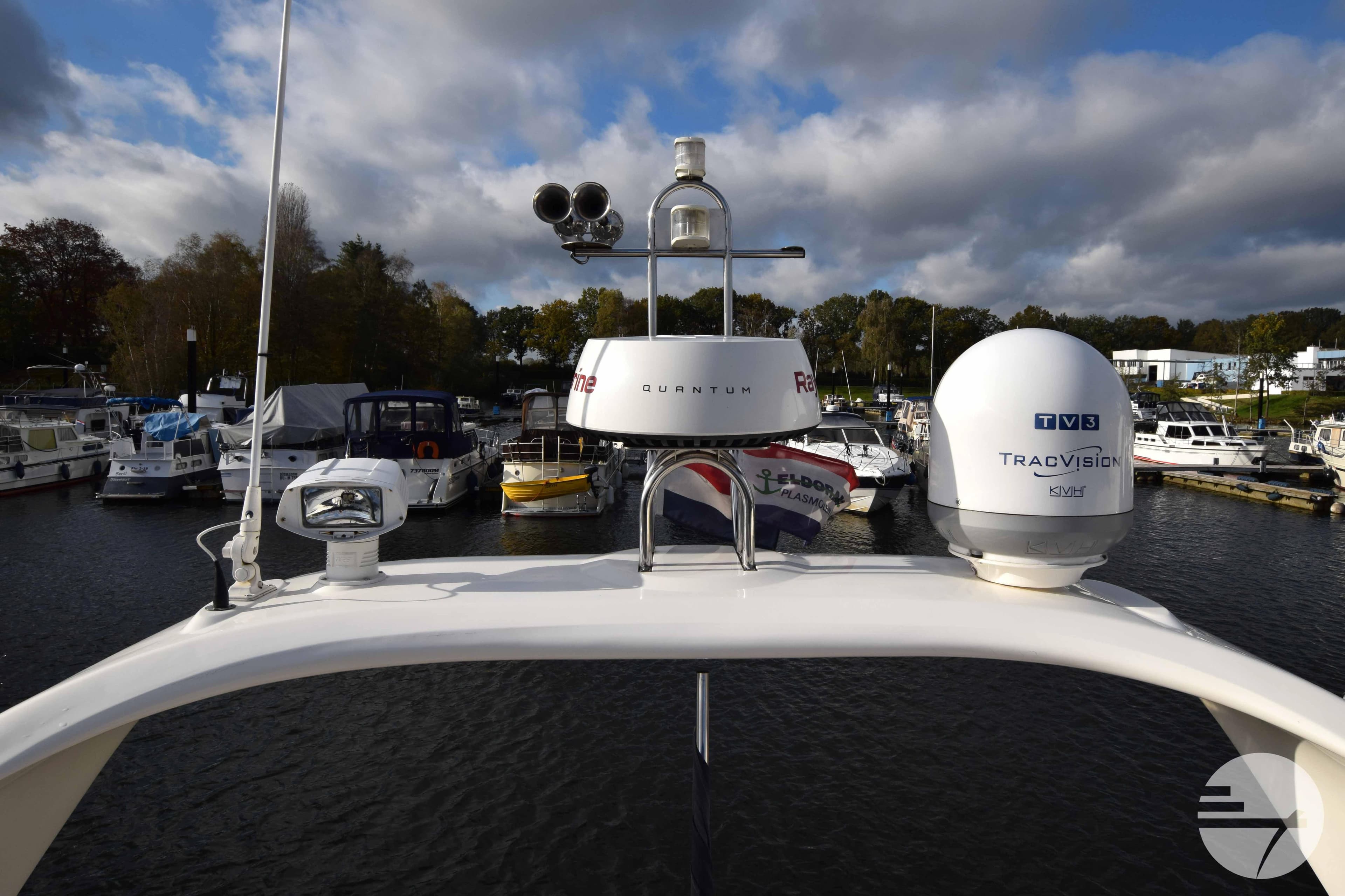 Fairline Phantom 43, 2001 model, docked in a busy marina.